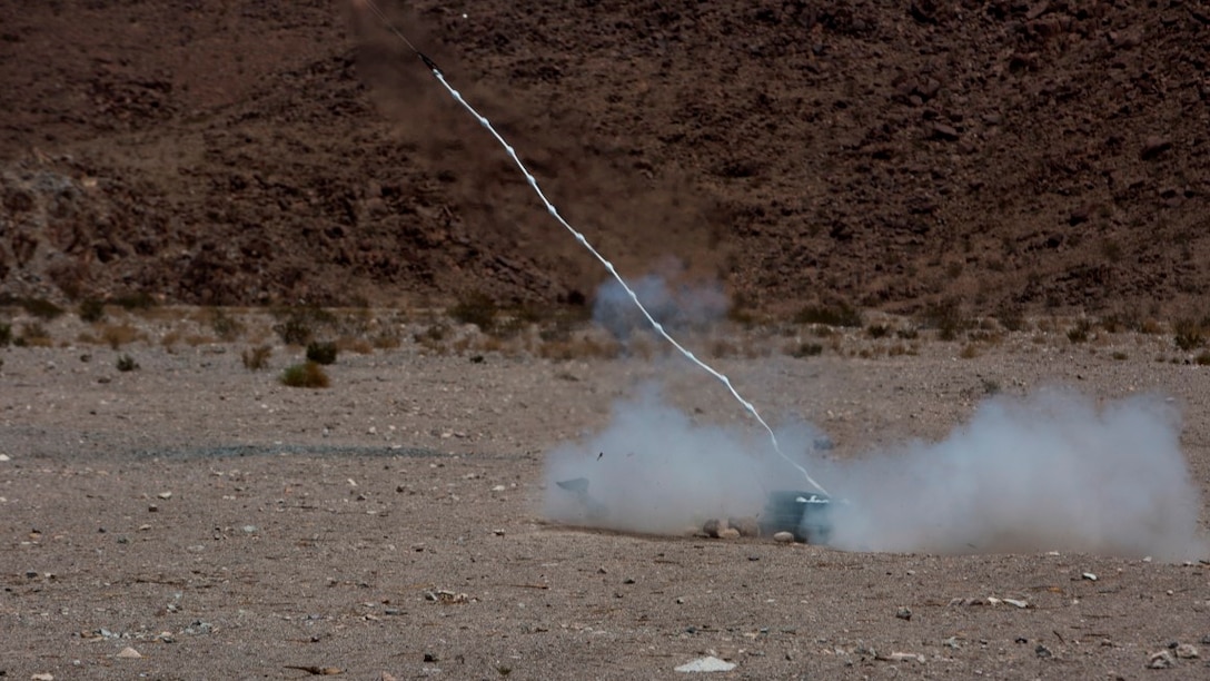 An Anti-Personnel Obstacle Breaching System device launches an explosive line charge during a live fire demolition range aboard Marine Corps Air Ground Combat Center Twentynine Palms, California, July 21. Marines with 1st Battalion, 3rd Marine Regiment, and 2nd Combat Engineer Battalion conducted the training to become more familiar with procedures required to employ the devices. 