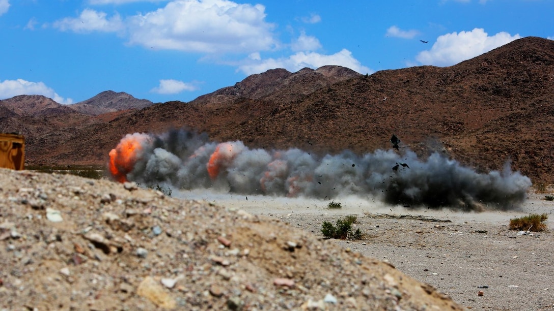 An Anti-Personnel Obstacle Breaching System detonates its explosive line charge during a live fire demolition range aboard Marine Corps Air Ground Combat Center Twentynine Palms, Calif., July 21. Marines with 1st Battalion, 3rd Marine Regiment, and 2nd Combat Engineer Battalion conducted the training to build confidence in the proper employment of the devices. 