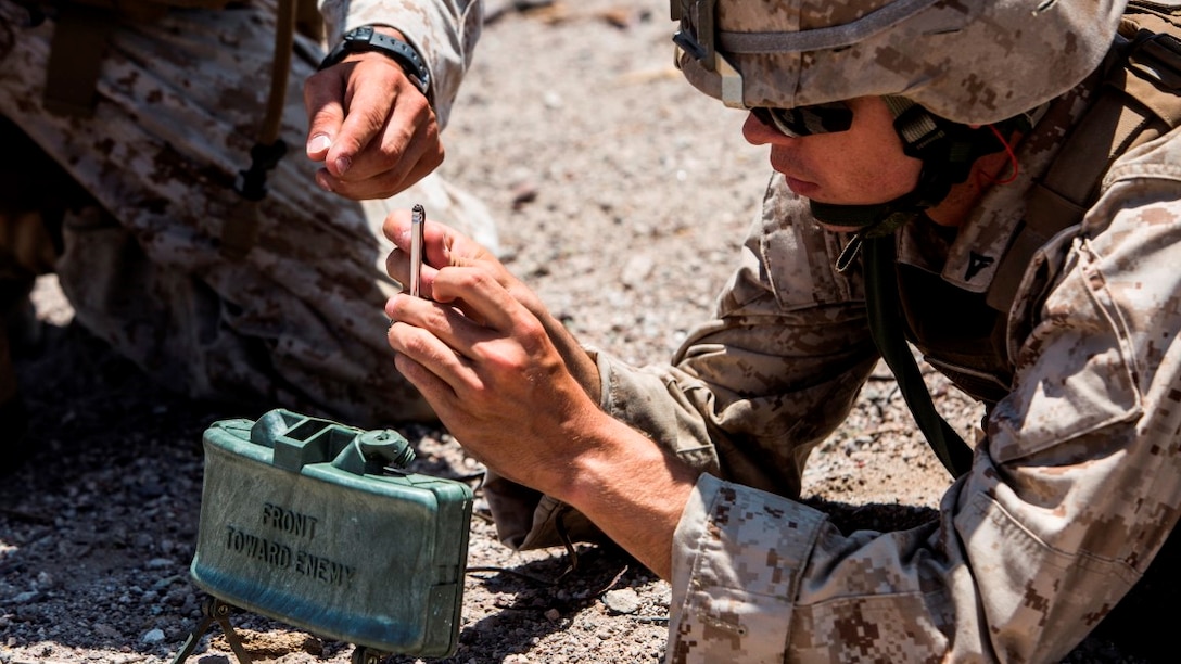 Lance Cpl. Colin Brennan, an assault man with Company A, 1st Battalion, 3rd Marine Regiment, prepares to insert a blasting cap into a claymore during training as the battalion prepares for an Integrated Training Exercise at Marine Corps Air Ground Combat Center Twentynine Palms, California, July 21. ITX focuses on the tactical application of combined arms maneuver warfare during global contingency operations. 






