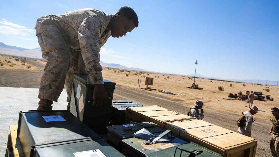 Lance Cpl. Demetrius Sanders, a motor transport operator with Headquarters and Service Company, 1st Battalion, 7th Marine Regiment, loads cases of ammunition onto a 7-ton Medium Tactical Vehicle during an Integrated Training Exercise at Marine Corps Air Ground Combat Center Twentynine Palms, California, July 22, 2015. Ammunition distribution is performed at the field ammunition supply point, which is set-up and operated by CLB-1, Ammunition Detachment. CLB-1 is currently training to support Special Purpose Marine Air Ground Task Force Crisis Response Central Command 16.1. 