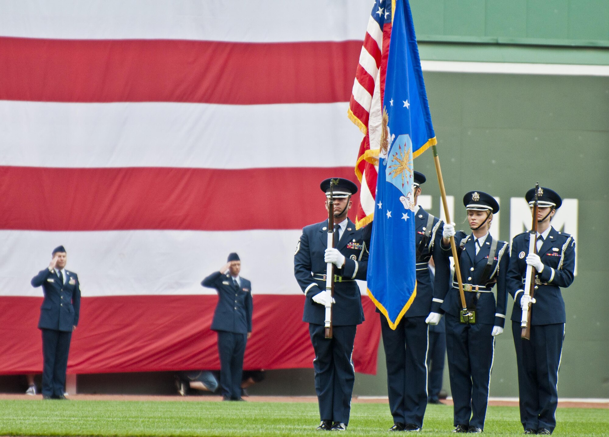Airmen from Westover Air Reserve Base, including the Honor Guard, stand on the field of Fenway Park.The on-field activities were a part of the Red Sox's Military Appreciation Game.