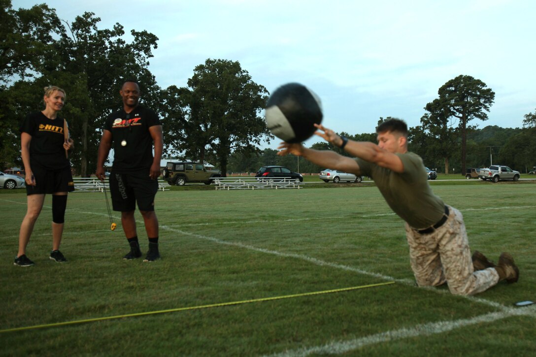 Sgt. Chad Seward, a reconfigurable transportable consolidated automated support system technician with Marine Aircraft Group 14, tosses a medicine ball for distance during the High Intensity Tactical Training program’s inaugural preliminary Tactical Athlete Competition at Marine Corps Air Station Cherry Point, North Carolina, July 22, 2015. The top male and female winners are scheduled to compete in the final event being held at Marine Corps Air Ground Combat Center, Twentynine Palms, California, on September 16 to compete for the Ultimate Tactical Athlete in the Marine Corps.