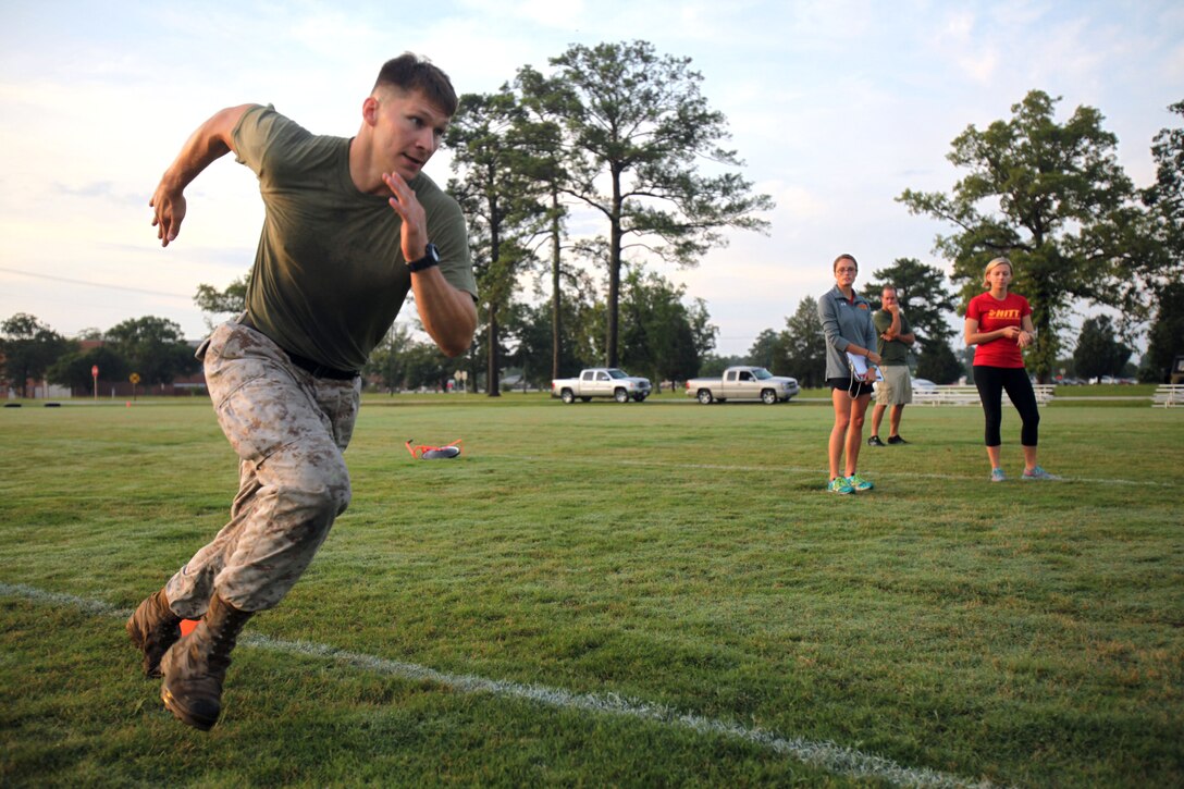Sgt. Chad Seward, a reconfigurable transportable consolidated automated support system technician with Marine Aircraft Group 14, sprints to a finish line during the High Intensity Tactical Training program’s inaugural preliminary Tactical Athlete Competition at Marine Corps Air Station Cherry Point, North Carolina, July 22, 2015. The top male and female winners are scheduled to compete in the final event being held at Marine Corps Air Ground Combat Center, Twentynine Palms, California, on September 16 to compete for the Ultimate Tactical Athlete in the Marine Corps.