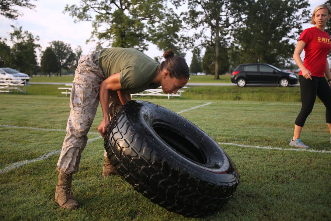 1st Lt. Shelly Ochoa, an adjutant with Marine Corps Air Squadron 2, flips a tire in a strength and endurance testing event during the High Intensity Tactical Training program’s inaugural preliminary Tactical Athlete Competition at Marine Corps Air Station Cherry Point, North Carolina, July 22, 2015. The top male and female winners are scheduled to compete in the final event being held at Marine Corps Air Ground Combat Center, Twentynine Palms, California, on September 16 to compete for the Ultimate Tactical Athlete in the Marine Corps.