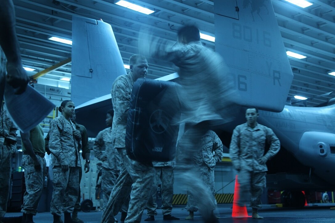 INDIAN OCEAN (July 22, 2015) A U.S. Marine with Marine Medium Tiltrotor Squadron 161 (Reinforced), 15th Marine Expeditionary Unit, executes a push kick during a Marine Corps Martial Arts Program (MCMAP) course aboard the amphibious assault ship USS Essex (LHD 2). These Marines were practicing MCMAP techniques in order to earn their brown or black belt.  Elements of the 15th MEU, based out of Camp Pendleton, California, and embarked aboard the Essex, are conducting naval operations in the 6th Fleet area of operations in support of U.S. national security interests in Europe and Africa. (U.S. Marine Corps photo by Staff Sgt. Miguel Carrasco/Released)