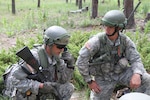 U.S. Army officer candidates call in a situation report up to command during Officer Candidate School on West Camp Rapid in Rapid City, S.D., July 16, 2015. Soldiers develop their leadership skills in an eight-week program instructed by the South Dakota Army National Guard’s 1st Battalion, 196th Regiment (Regional Training Institute) to earn their commission as a second lieutenants in the Army National Guard. (U.S. Army National Guard photo by Pvt. Joshua Quandt)