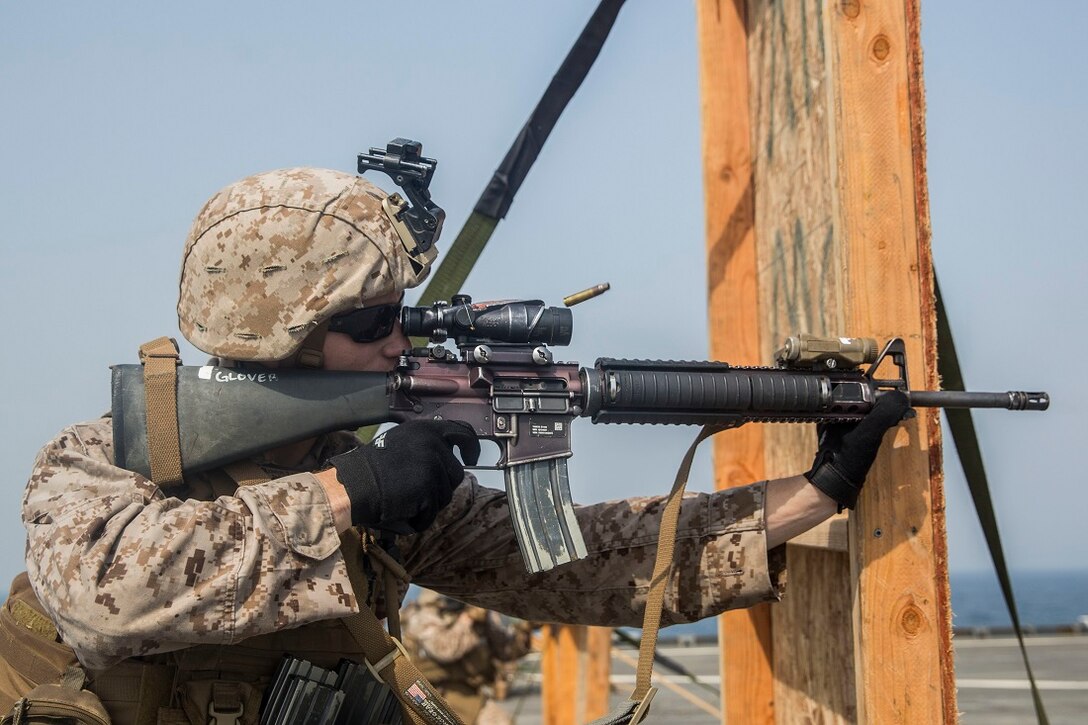 ARABIAN GULF (July 22, 2015) U.S. Marine Lance Cpl. Trevor Glover fires at his target during a short-range marksmanship qualification course aboard the dock landing ship USS Rushmore (LSD 47). Glover is a is rifleman with Kilo Company, Battalion Landing Team 3rd Battalion, 1st Marine Regiment, 15th Marine Expeditionary Unit. The marksmanship course focused on improving Marine’s communication during combat shooting, as well as immediate action tactics, which prepare them for potential operations while deployed with the 15th MEU. The 15th MEU is embarked on the Essex Amphibious Ready Group and is deployed to maintain regional security in the U.S. 5th Fleet area of operations. (U.S. Marine Corps photo by Sgt. Emmanuel Ramos/Released)