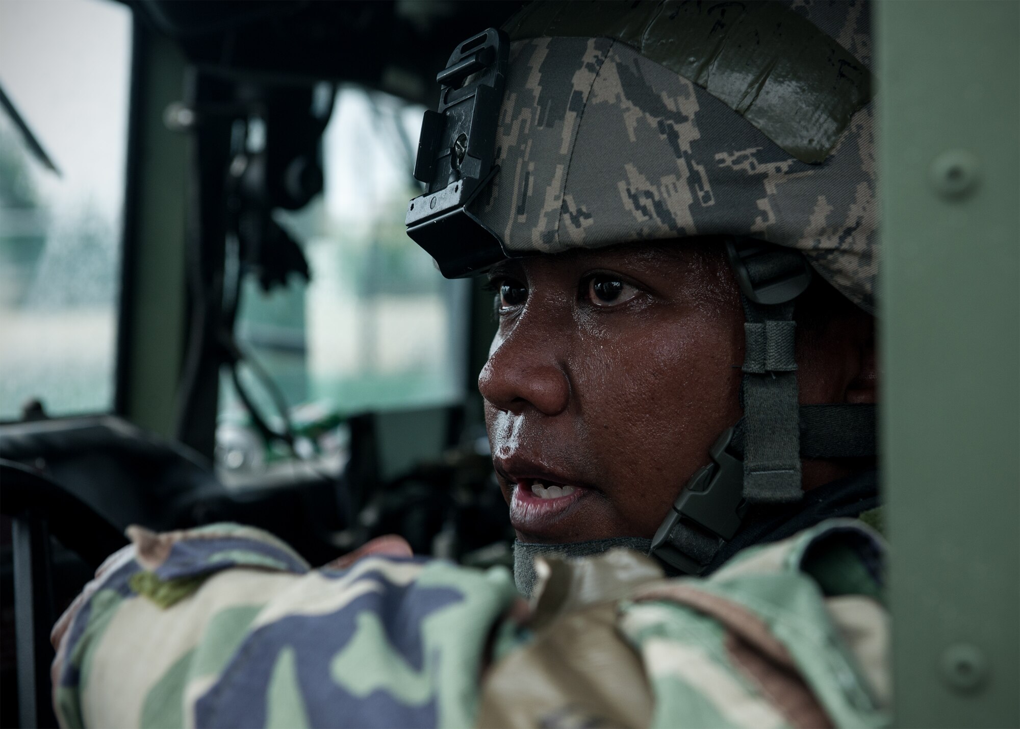 U.S. Air Force Tech. Sgt. Jay Fulinara, 8th Security Forces Squadron bravo flight chief, discusses preliminary security for the perimeter of a building following a simulated improvised explosive device emergency during Exercise Beverly Midnight 15-4 at Kunsan Air Base, Republic of Korea, July 15, 2015. During the five-day operational readiness exercise, Wolf Pack Airmen donned mission oriented protective posture gear as they reacted, survived and operated in a simulated combat zone. (U.S. Air Force photo by Senior Airman Katrina Heikkinen/Released)