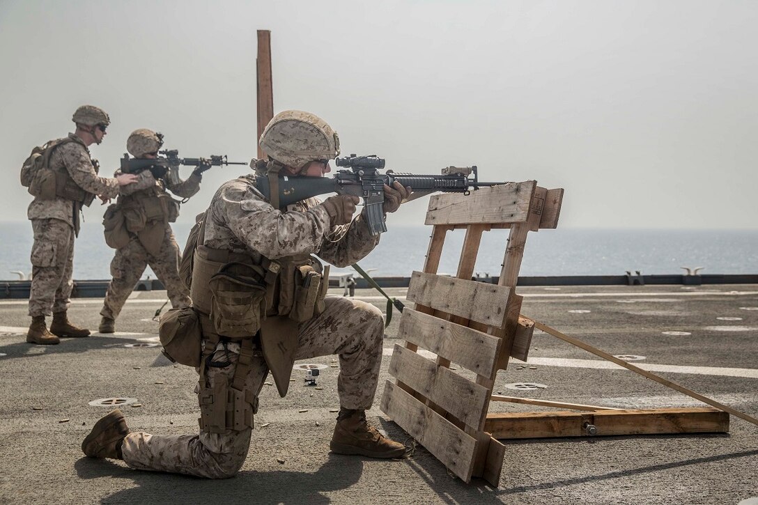 ARABIAN GULF (July 22, 2015) U.S. Marines Kilo Company, Battalion Landing Team 3rd Battalion, 1st Marine Regiment, 15th Marine Expeditionary Unit, fire at their targets during a short-range marksmanship qualification course aboard the dock landing ship USS Rushmore (LSD 47). The marksmanship course focused on improving Marine’s communication during combat shooting, as well as immediate action tactics, which prepare them for potential operations while deployed with the 15th MEU. The 15th MEU is embarked on the Essex Amphibious Ready Group and is deployed to maintain regional security in the U.S. 5th Fleet area of operations. (U.S. Marine Corps photo by Sgt. Emmanuel Ramos/Released)