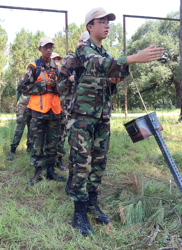 Cadet Airman First Class Blake Jones, Echo Flight, Squadron 2, Georgia Wing Civil Air Patrol, points his team in the direction to find their next objective during land navigation training, July 22. This is the fourth year the Georgia Wing CAP has conducted its weeklong summer encampment at Marine Corps Logistics Base Albany. 