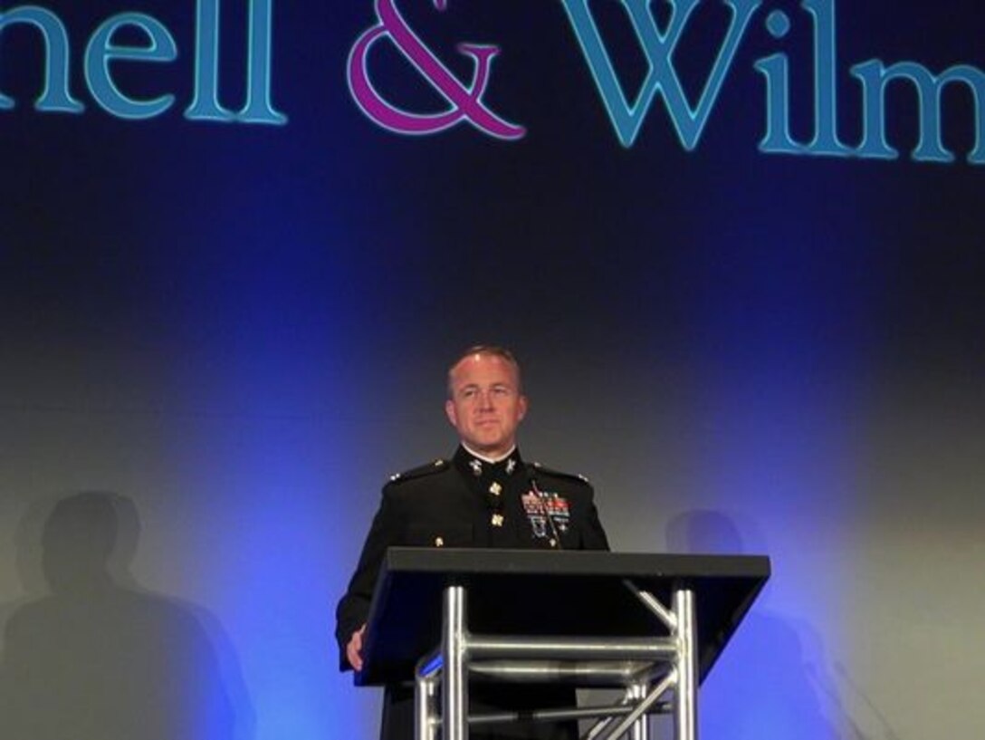 Snell & Wilmer partner Rick Erickson, in uniform, at an attorney retreat discussing the efforts the company does for veterans and active service members at the firm.