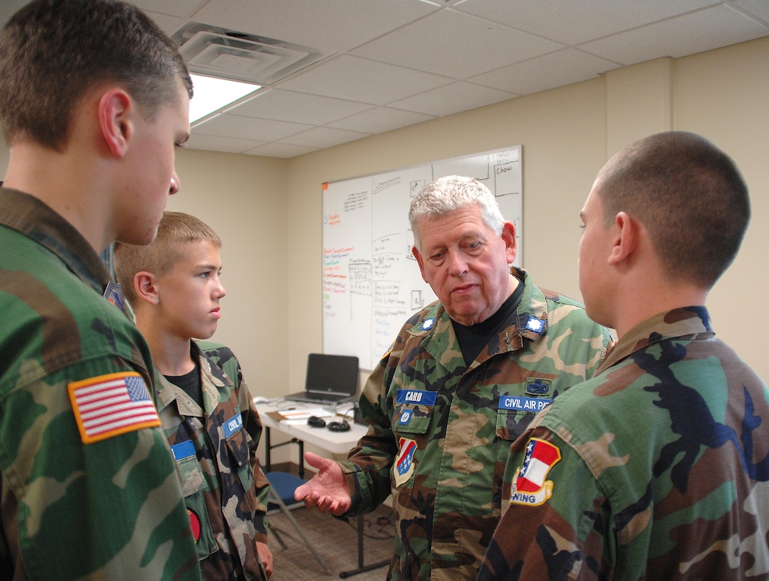 Lt. Col. James Card, (center), assistant director of communications and licensing officer, Georgia Wing Civil Air Patrol, mentors with young cadets during Georgia Wing CAP’s weeklong summer encampment at Marine Corps Logistics Base Albany, July 21-25.