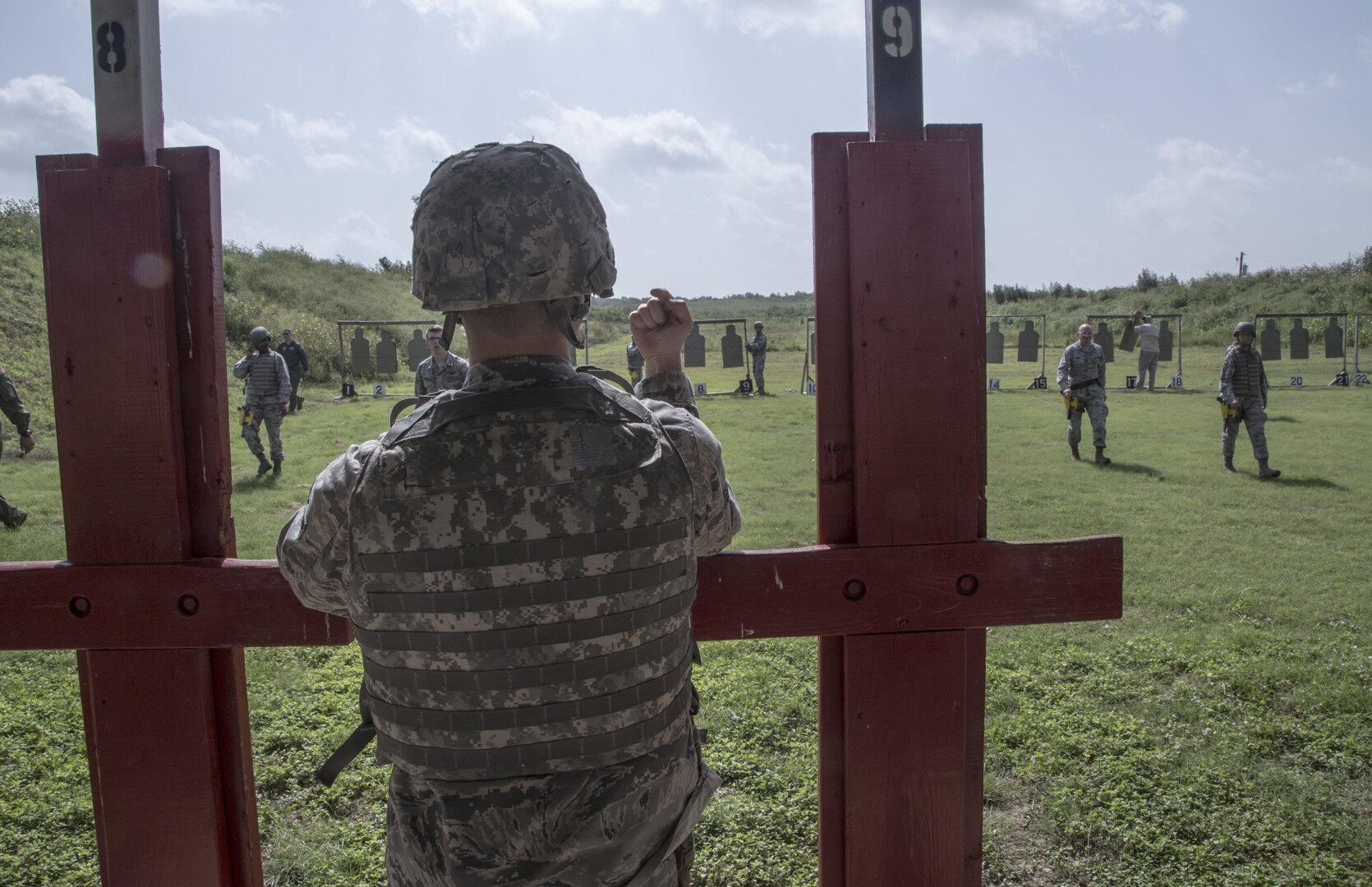A weapons qualification course student directs fellow students on the placement of targets during the live range portion of their training July 6 at the Joint Base San Antonio-Lackland Medina Annex. The weapons qualification course is part of the Combat Arms Training and Maintenance program that introduces basic firearm safety and use practices for Airmen in Air Force Basic Military Training and refreshes that training for JBSA members deploying or undergoing a permanent change of station. 