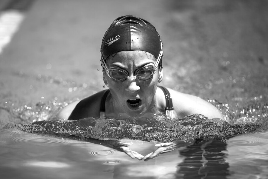 U.S. Air Force 1st Lt. Morgan K. Diglia, Sexual Assault Response Coordinator deputy, swims laps at the McGarr Pool on Goodfellow Air Force Base, Texas, July 24, 2015. Diglia has been swimming competitively since she was young and now uses those skills to compete in triathlons. (U.S. Air Force photo by Staff Sgt. Michael Smith/Released)