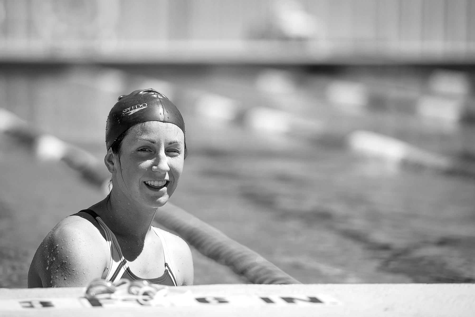 U.S. Air Force 1st Lt. Morgan K. Diglia, Sexual Assault Response Coordinator deputy, takes a break while swimming at McGarr Pool on Goodfellow Air Force Base, Texas, July 24, 2015. Diglia is preparing for an upcoming olympic triathlon. (U.S. Air Force photo by Staff Sgt. Michael Smith/Released)