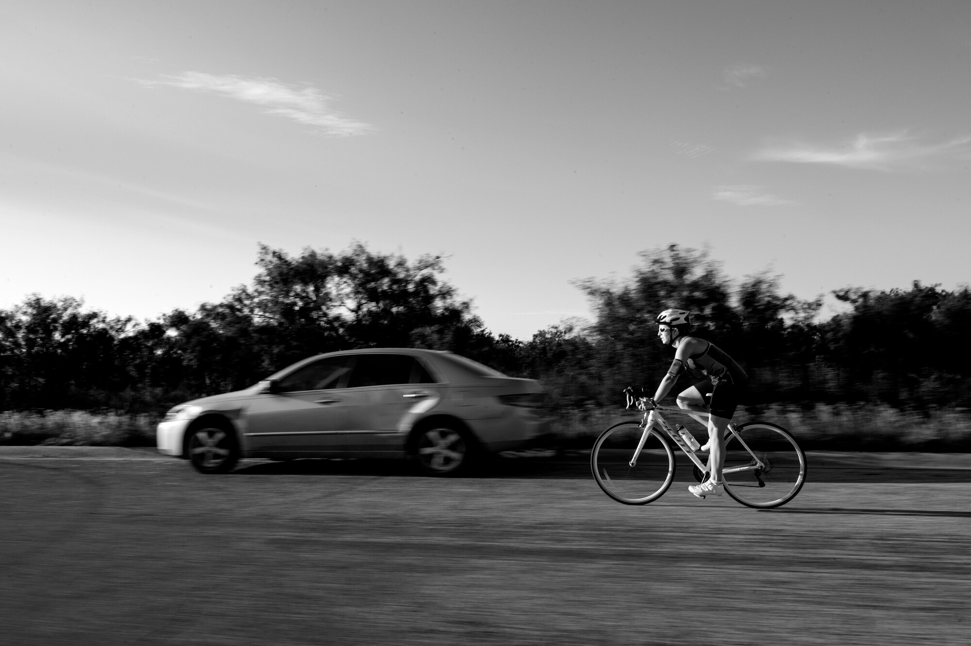 U.S. Air Force 1st Lt. Morgan K. Diglia, Sexual Assault Response Coordinator deputy, rides a bike during a triathlon training session in San Angelo, Texas, July 22, 2015. Diglia is preparing for her first olympic triathlon. (U.S. Air Force photo by Staff Sgt. Michael Smith/Released)