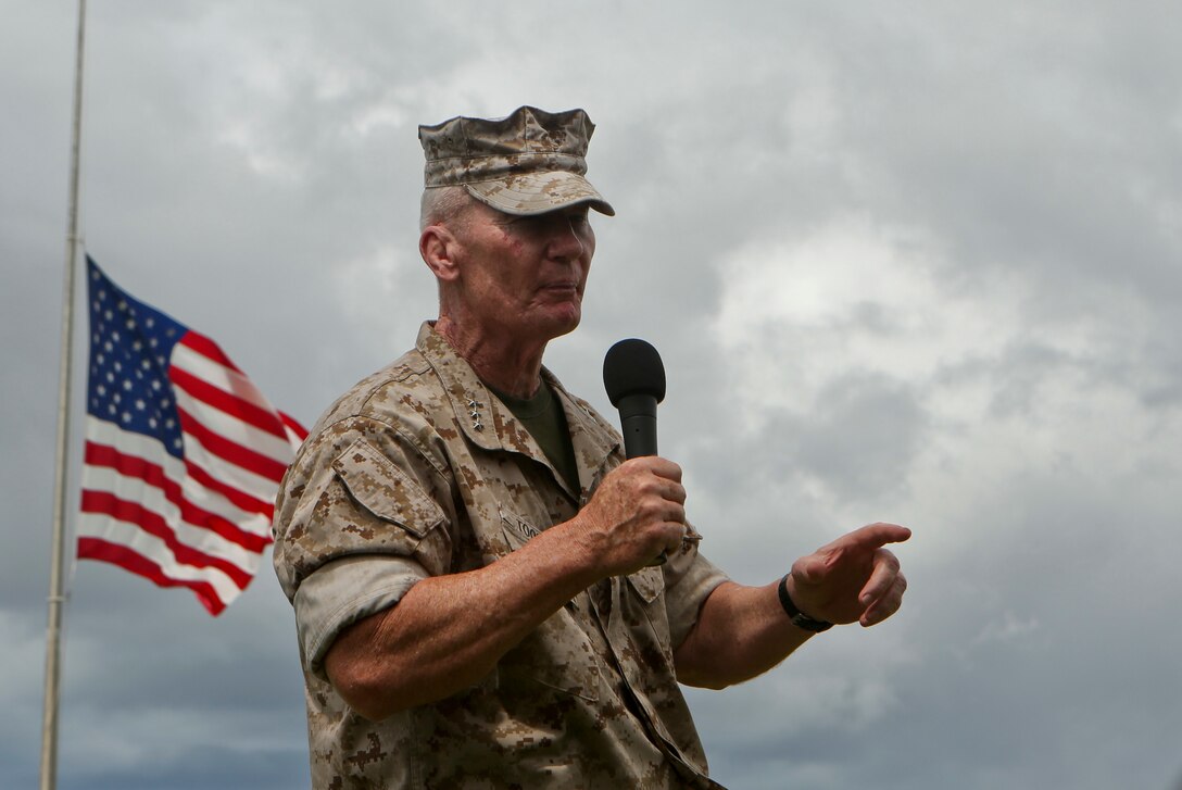 U.S. Marine Corps Forces, Pacific Commander Lt. Gen. John A. Toolan speaks during the change of command ceremony on Camp H. M. Smith, Hawaii, July 24, 2015. During the ceremony, Col. Darric M. Knight relinquished his duties as MARFORPAC Headquarters and Service Battalion to Col. Peter S. Gadd. 