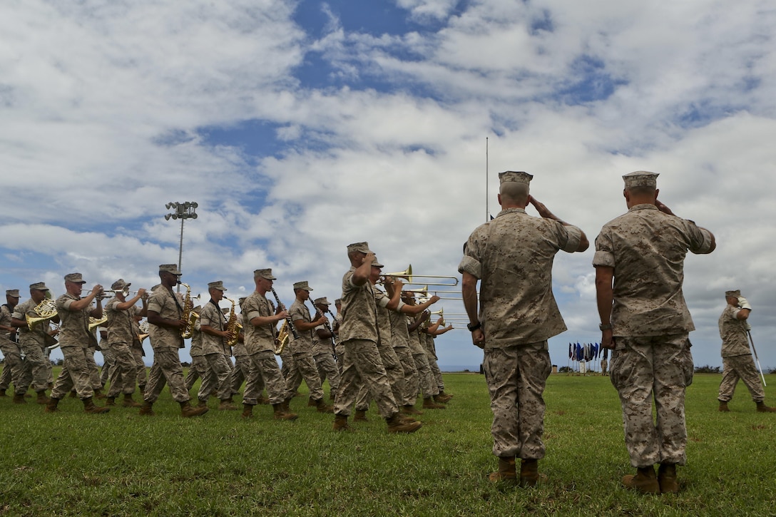The U.S. Marine Corps Forces, Pacific Band performs at the change of command ceremony on Camp H.M. Smith, Hawaii, July 24, 2015. During the ceremony, Col. Darric M. Knight relinquished his duties as MARFORPAC Head Quarters and Service Battalion Commanding Officer.