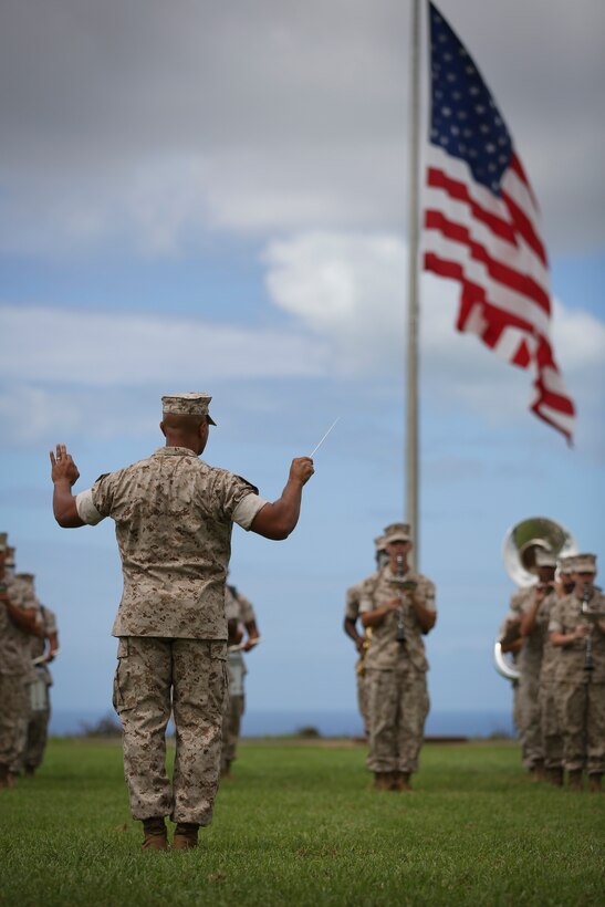 The U.S. Marine Corps Forces, Pacific Band performs at the change of command ceremony on Camp H. M. Smith, Hawaii, July 24, 2015. During the ceremony, Col. Darric M. Knight relinquished his duties as MARFORPAC Head Quarters and Service Battalion Commanding Officer.