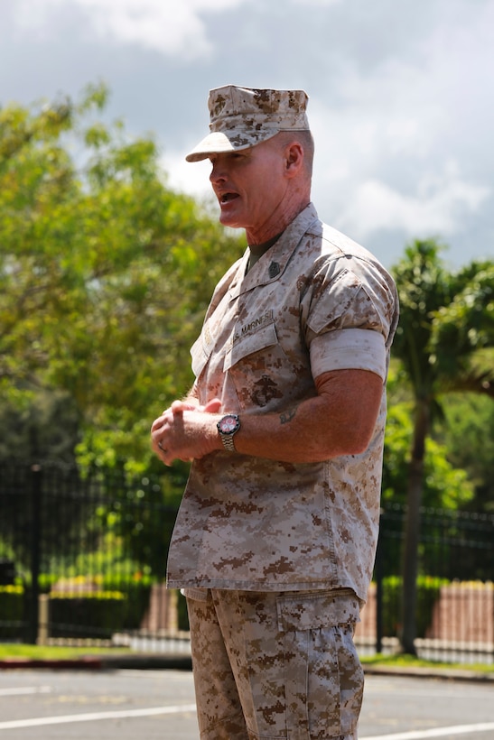 U.S. Marine Corps Forces, Pacific Sergeant Major Paul G. McKenna speaks during the relief and appointment ceremony on Camp H. M. Smith, Hawaii, July 23, 2015. During the ceremony, Sgt. Maj. William T. Stables relinquished his duties as MARFORPAC sergeant major to Sgt. Maj. Paul G. McKenna. 