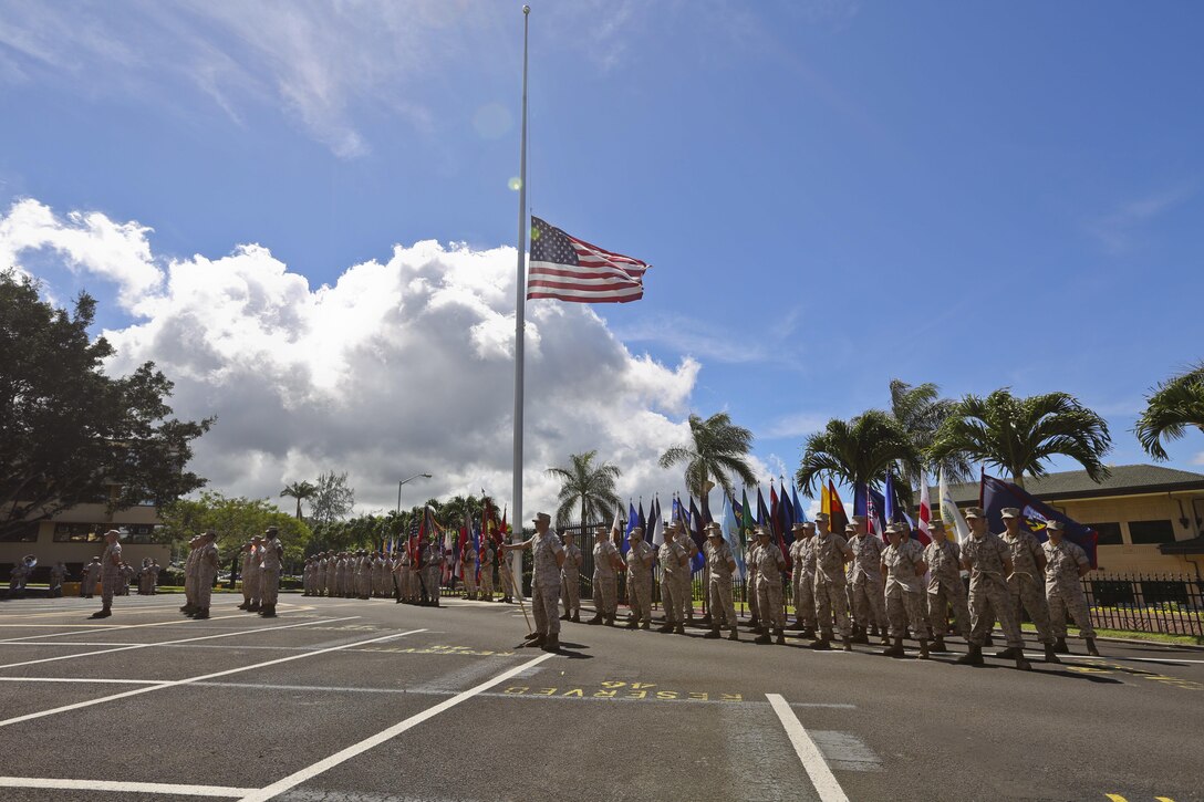 Staff Sgt. Michael W. Hartley, commander of troops, Headquarters and Service Battalion, U.S. Marine Corps Forces, Pacific, orders the formation to parade rest during the relief and appointment ceremony on Camp H. M. Smith, Hawaii, July 23, 2015. During the ceremony, Sgt. Maj. William T. Stables relinquished his duties as MARFORPAC sergeant major to Sgt. Maj. Paul G. McKenna. 