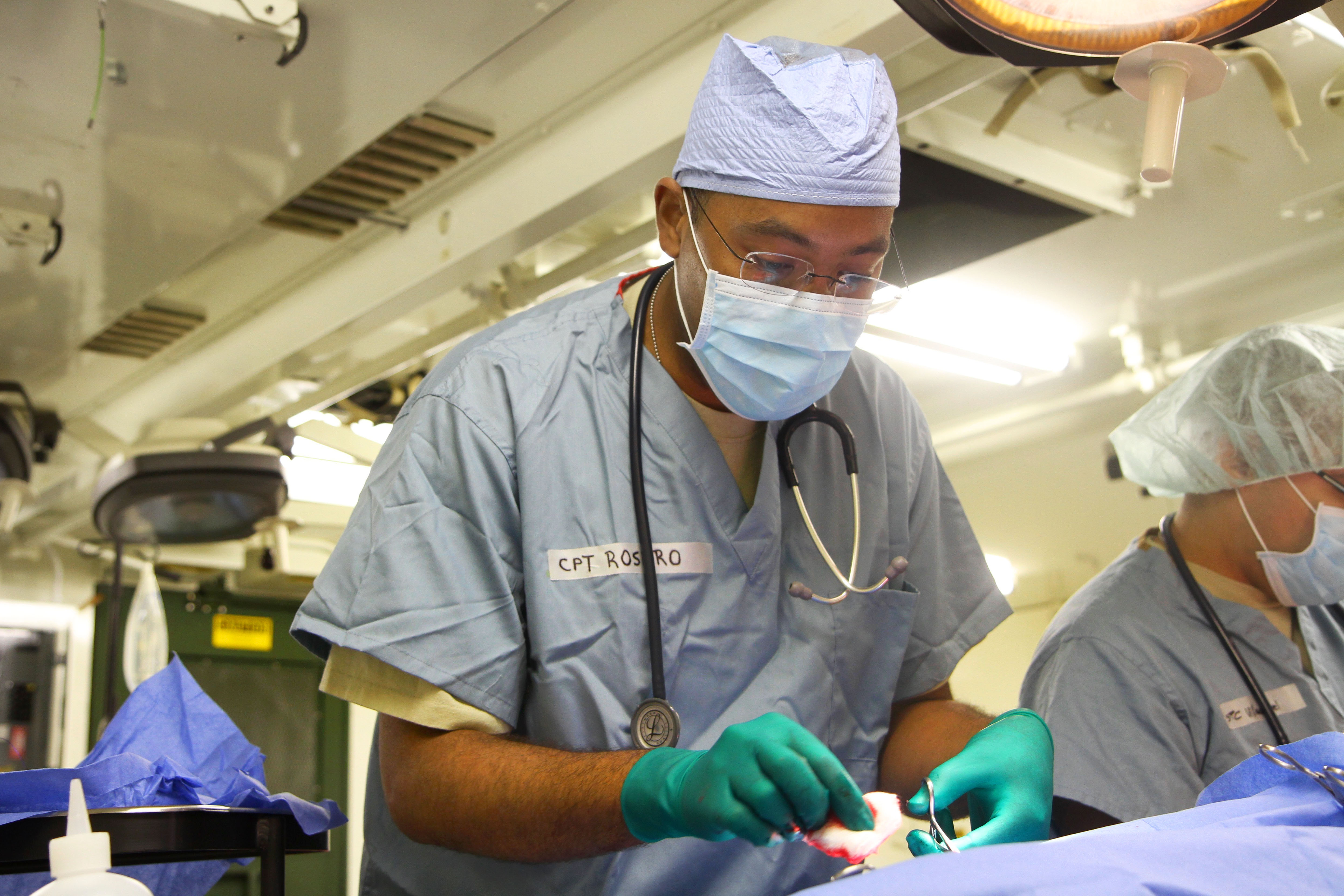 U.S. Army Reserve Capt. Jonathan Rosero provides veterinary services
