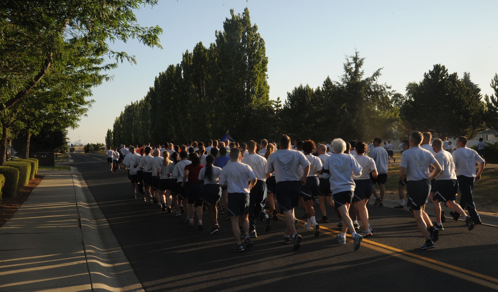 Airmen begin the monthly wing run starting and ending at the 92nd MDG July 24, 2015, at Fairchild Air Force Base, Wash. Wing runs enhance unit cohesion through a shared enterprise. (U.S. Air Force photo/Senior Airman Sam Fogleman)