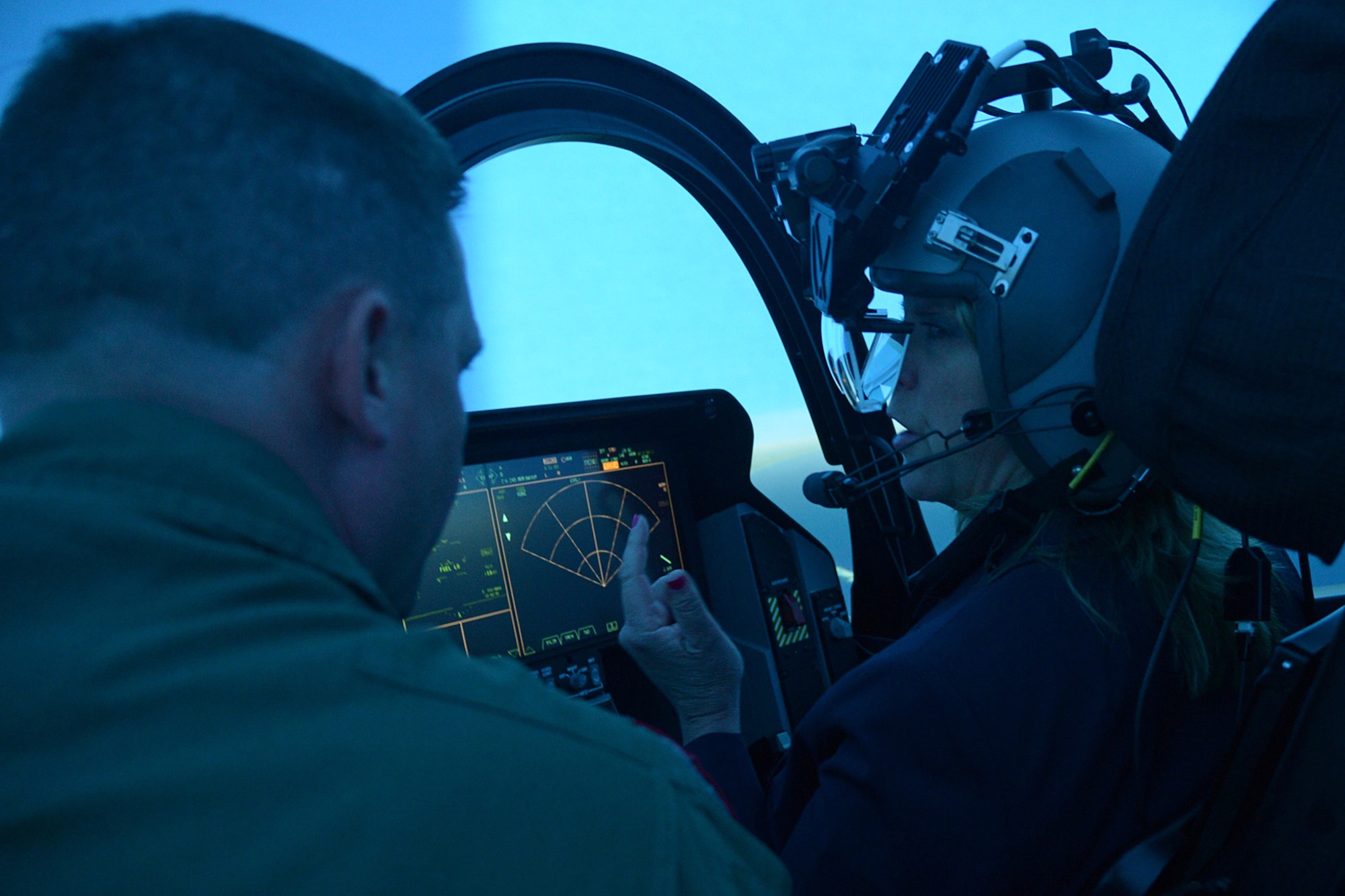 Secretary of the Air Force Deborah Lee James sits in an F-35 aircraft simulator during her visit to Hill Air Force Base, Utah, Thursday, July 23. While she was in the simulator, Col. David Lyons, 388th Fighter Wing commander, discussed the F-35 and differences between it and the F-16 fighter. James toured facilities and met with Team Hill Airmen and local community leaders. (U.S. Air Force photo by Alex R. Lloyd)
