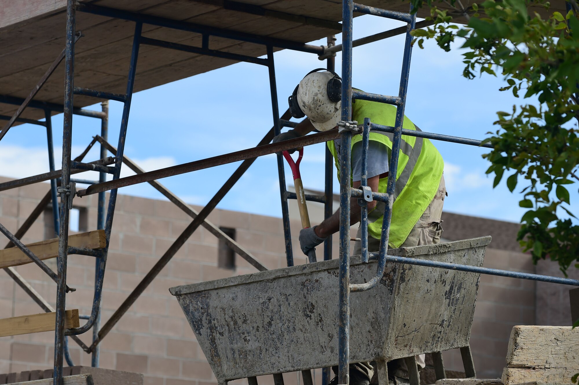 Rich Pludowski, a mason with Alaric Inc., a masonry contractor, prepares mortar during construction to the firehouse July 24, 2015, on Buckley Air Force Base, Colo. The new renovations to the firehouse will include five new dormitories for Buckley firefighters. (U.S. Air Force photo by Airman 1st Class Luke W. Nowakowski/Released)