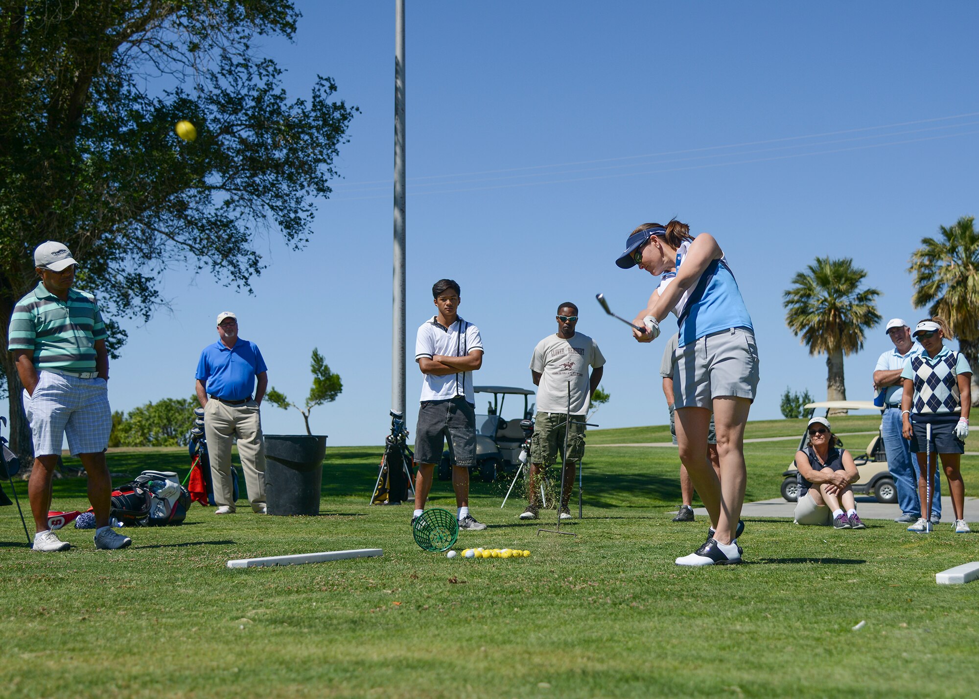 LPGA tour player Stephanie Louden demonstrated how to correctly use three golf clubs, a wedge, a 7-iron and a driver during the free golf clinic July 24. (U.S. Air Force photo by Rebecca Amber)