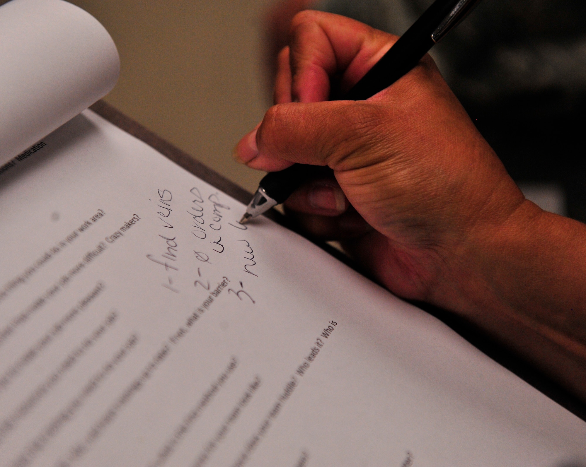 Claudia Enriquez, the 49th MDG Patient Safety Program manager, makes a note on feedback she received while on a patient safety leadership round. The rounds facilitate direct leadership involvement in patient safety programs throughout the medical group while providing staff members a unique way to offer feedback. (U.S. Air Force photo by Tech. Sgt. Matthew Rosine) 