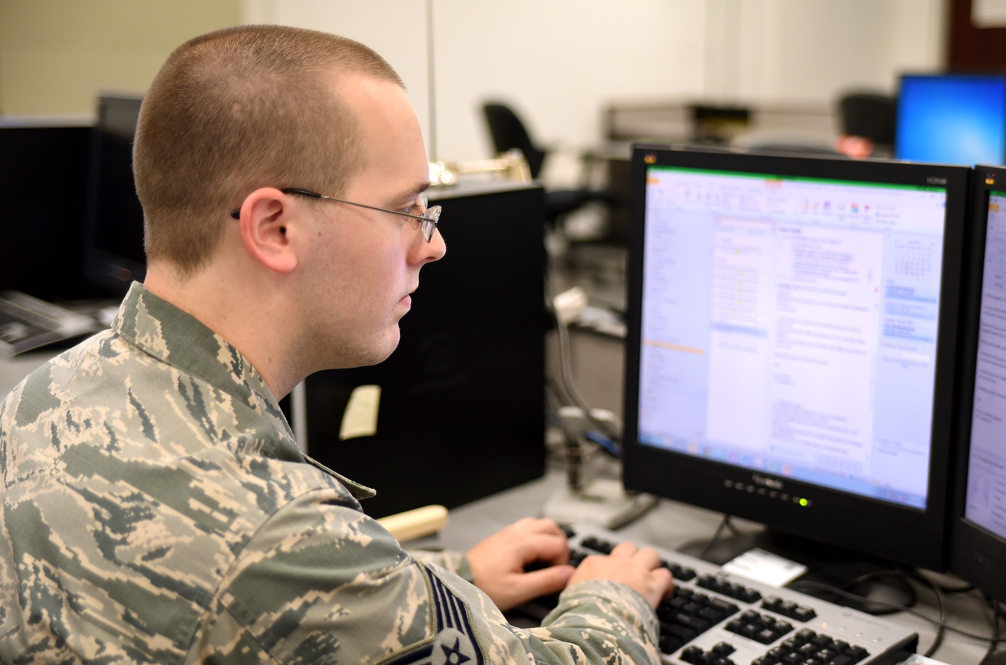 Staff Sgt. Jonathan Kolhagen, of the 421st Combat Training Squadron who acts as a Joint Staff member during Exercise Turbo Distribution 15-7, coordinates a support request with a participant during TD 15-7 at Joint Base McGuire-Dix-Lakehurst, New Jersey, on July 21, 2015. His role helps to provide a realistic picture of the support a deployed unit would receive from a Combatant Command. TD 15-7, a Joint Task Force-Port Opening (JTF-PO) field training exercise, hosted by the U.S. Air Force Expeditionary Center at Joint Base McGuire-Dix-Lakehurst, New Jersey, tests the ability to rapidly deploy and employ a JTF-PO Aerial Port of Debarkation (APOD) enabling capability in direct support to a regional combatant command. (U.S. Air Force photo/Danielle Brooks)