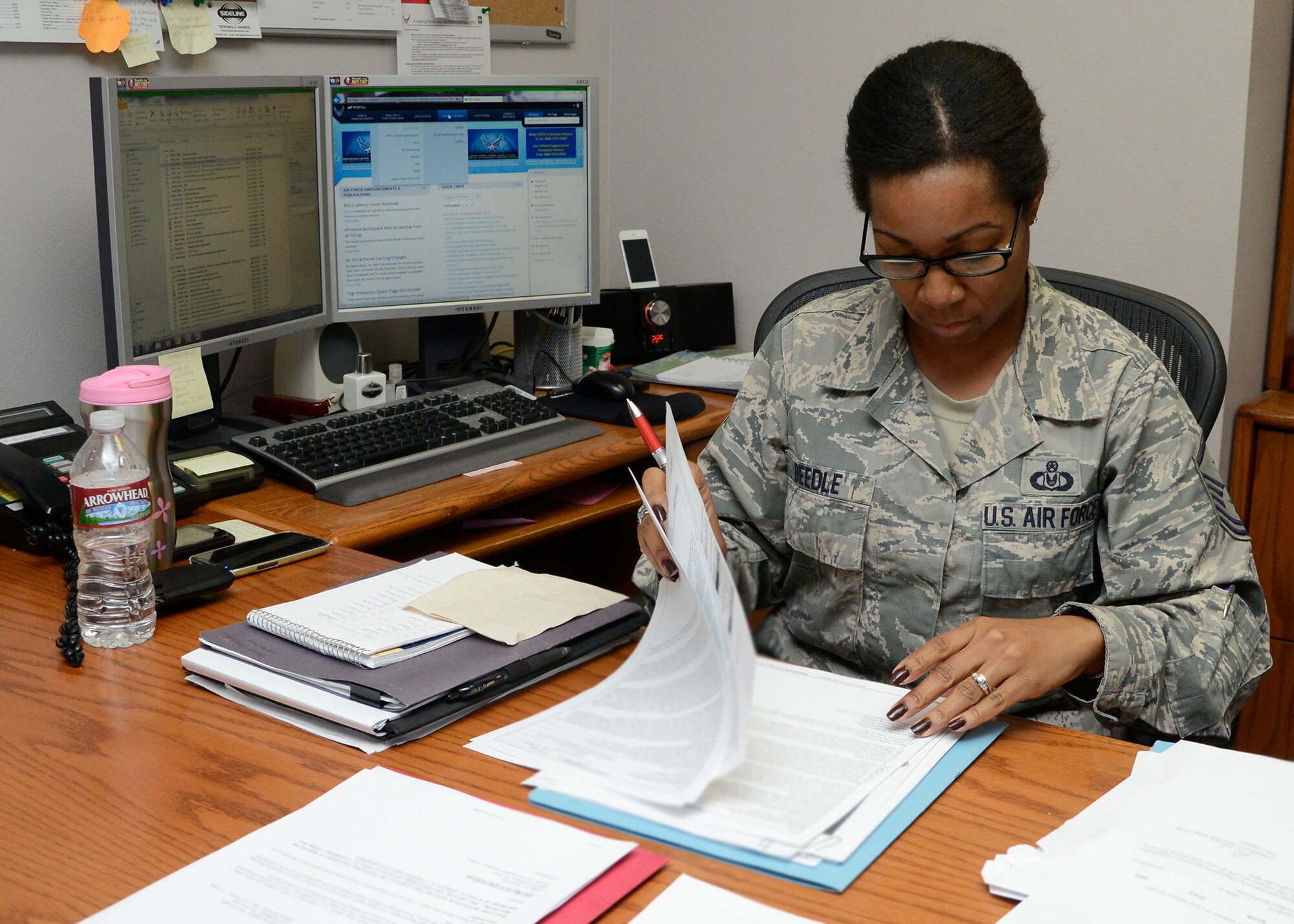 Master Sgt. Carmina Beedle, 56th Force Support Squadron first sergeant, reviews
paperwork in her office at the block house.