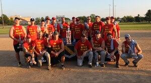 Members of the 174th Aerial Defense Artillery Brigade pose with their trophy from the Joint Base Andrews’ championship softball game, July 21, 2015, at the West Fitness Center softball fields. The 174th Air Defense Artillery Brigade softball team won two games against the 1st Helicopter Squadron softball team to win the championship. (U.S. Air Force photo/ Airman 1st Class J.D. Maidens)