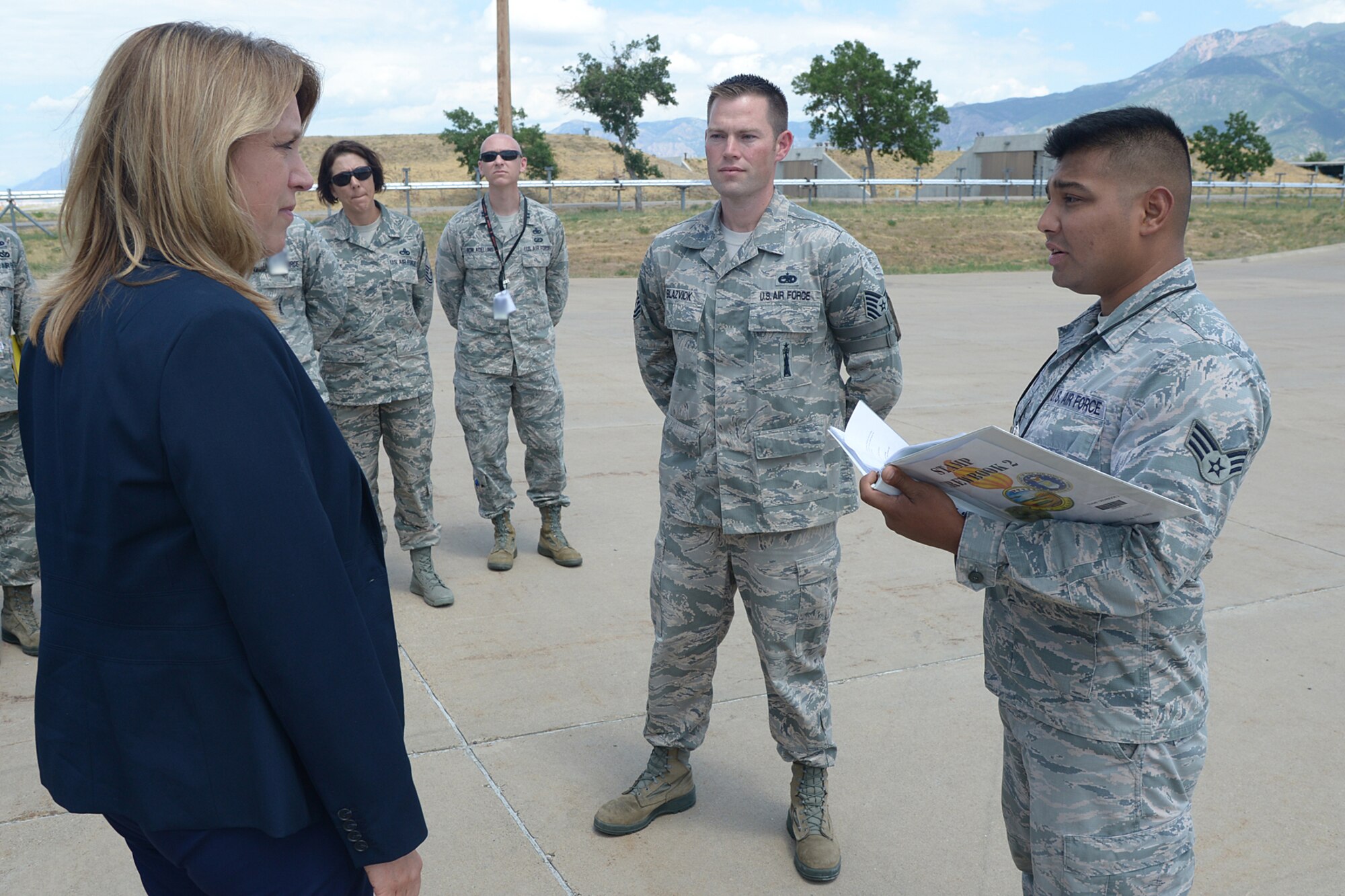 Secretary of the Air Force Deborah Lee James receives a safety briefing from Senior Airman Luis Salinas, 649th Munitions Squadron, during her visit to Hill Air Force Base, Utah, Thursday, July 23. While at the 649th, James received a mission overview and Standard Air Munitions Package (STAMP) update. STAMP is a munitions package used to resupply warfighters. (U.S. Air Force photo by Alex R. Lloyd/Released)