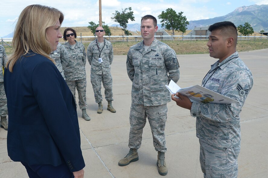 Secretary of the Air Force Deborah Lee James receives a safety briefing from Senior Airman Luis Salinas, 649th Munitions Squadron, during her visit to Hill Air Force Base, Utah, on July 23, 2015. While at the 649th, James received a mission overview and Standard Air Munitions Package, or STAMP, update. STAMP is a munitions package used to resupply warfighters. (U.S. Air Force photo/Alex R. Lloyd) 