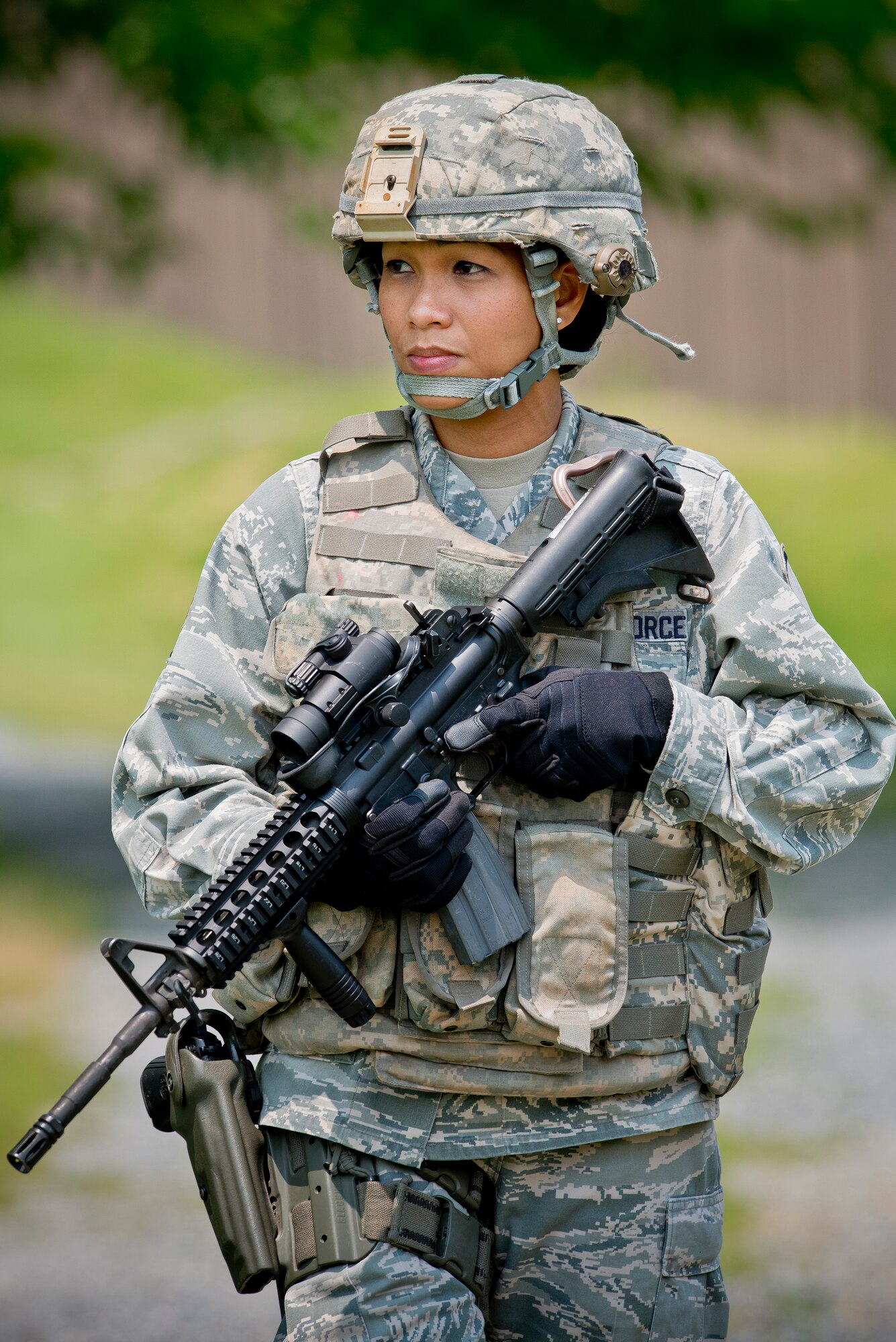Master Sgt. Maria Victoria R. Quitugua, a security forces craftsman assigned to the 254th Security Forces Squadron, Guam Air National Guard, stands near a trail at Joint Base Andrews, Md., June 10, 2015. Quitugua is the 2015 Air National Guard Outstanding Senior NCO of the Year. (Air National Guard photo by Master Sgt. Marvin R. Preston/Released)