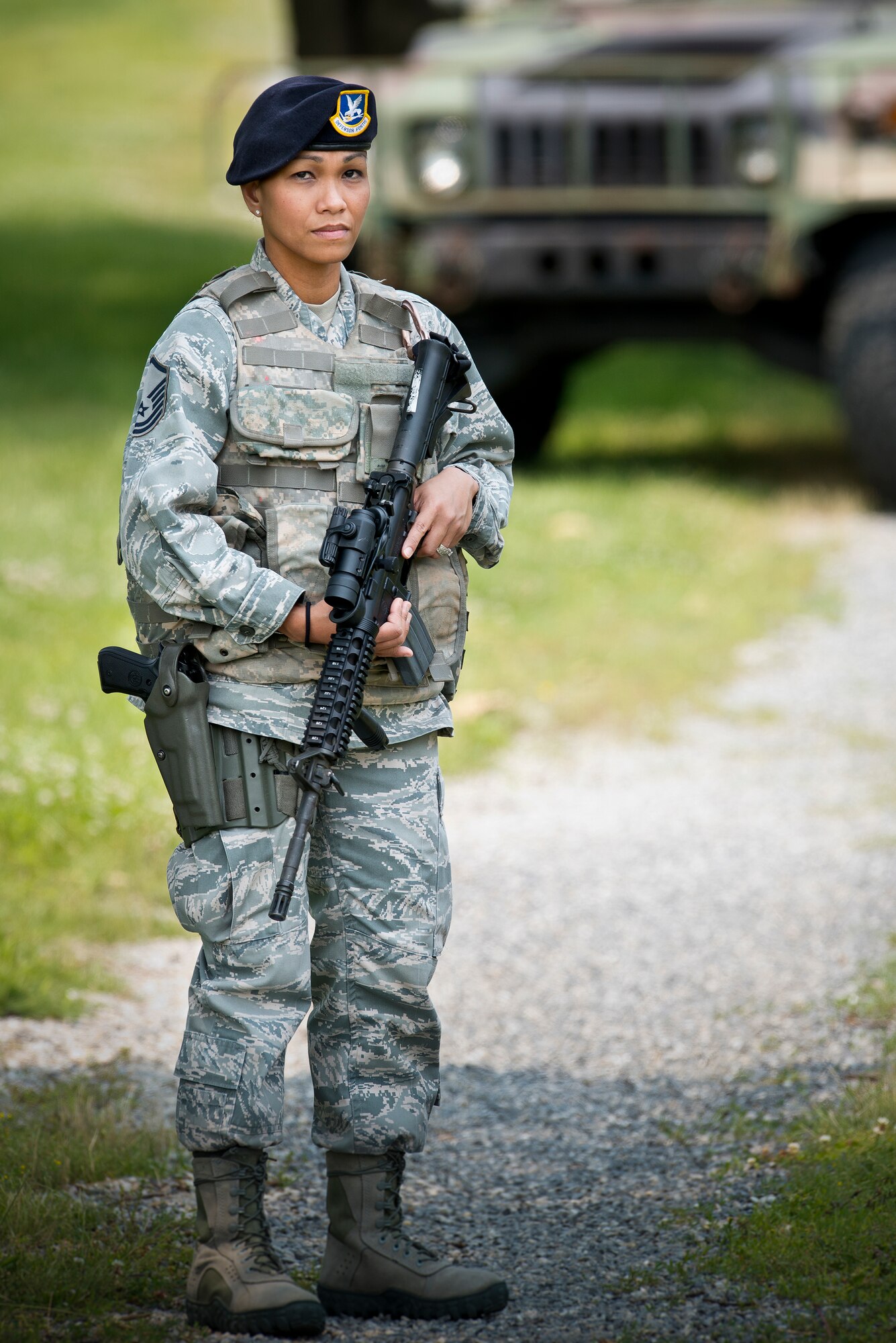 Master Sgt. Maria Victoria R. Quitugua, a security forces craftsman assigned to the 254th Security Forces Squadron, Guam Air National Guard, stands near a trail at Joint Base Andrews, Md., June 10, 2015. Quitugua is the 2015 Air National Guard Outstanding Senior NCO of the Year. (Air National Guard photo by Master Sgt. Marvin R. Preston/Released)