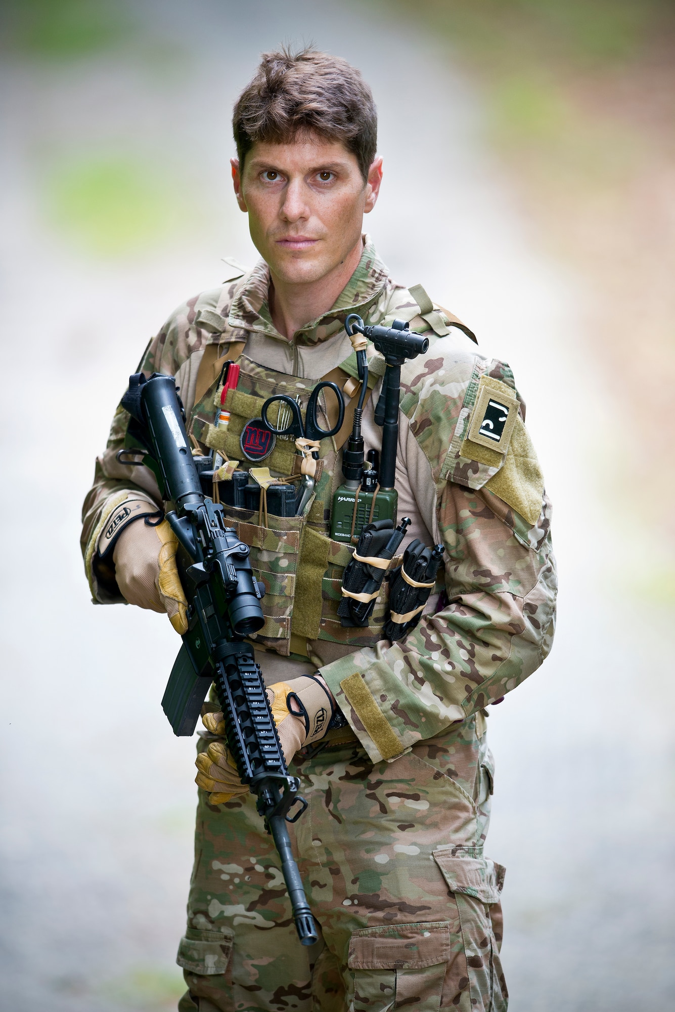 Staff Sgt. Douglas P. Kechijian, a pararescue Airman assigned to the 103rd Rescue Squadron, New York Air National Guard stands near a trail at Joint Base Andrews, Md., June 9, 2015. Kechijian is the 2015 Air National Guard Outstanding Non-Commissioned Officer of the Year.  (Air National Guard photo by Master Sgt. Marvin R. Preston/Released)
