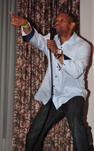 Fred McKinnon, comedian and U.S. Army Training and Doctrine Command information technology specialist, performs at the Fort Eustis Club on Fort Eustis, Va., June 27, 2015. McKinnon, who is a U.S. Army veteran, performs for various audiences including Service members and their families. (U.S. Air Force courtesy photo/released)