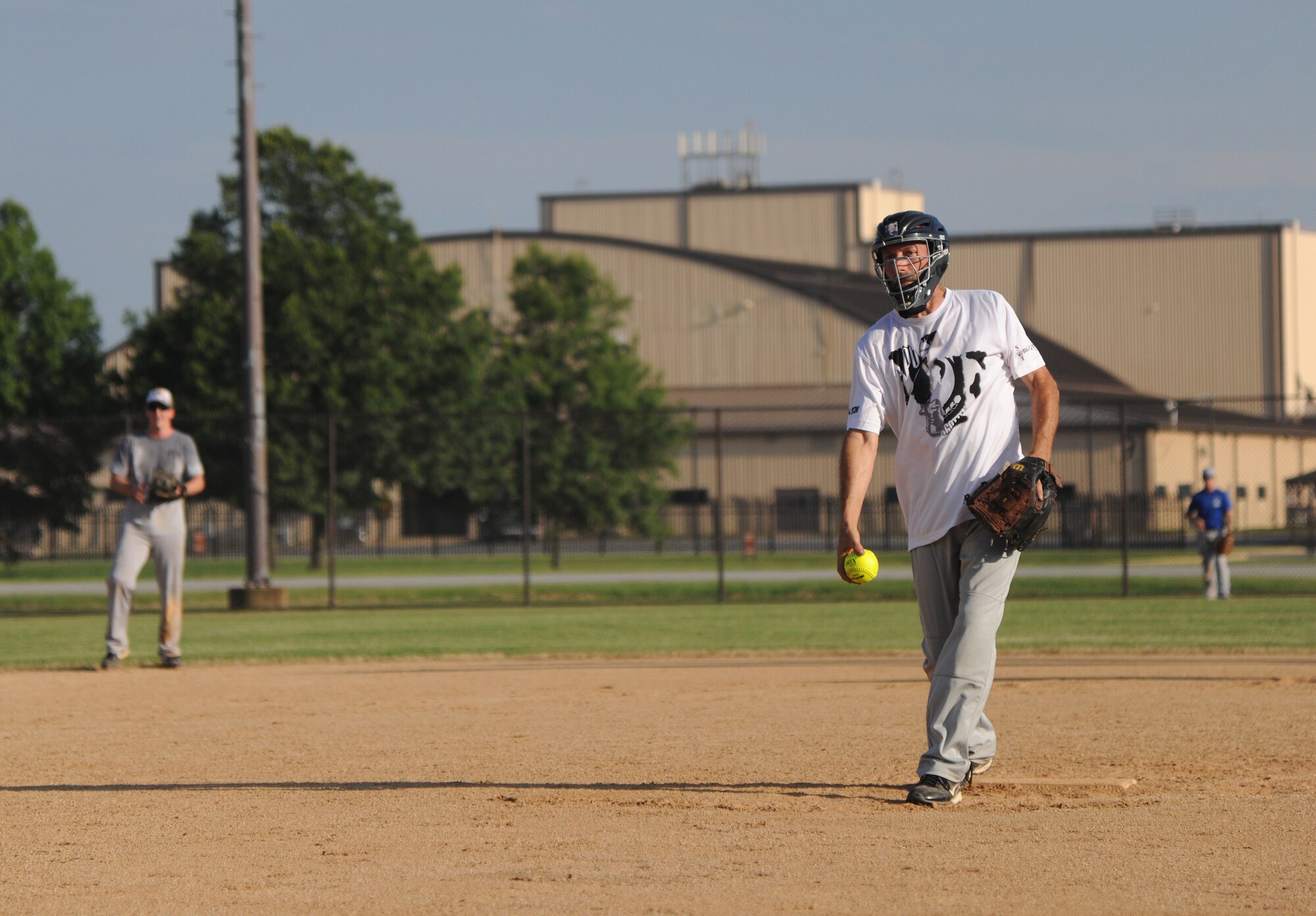 Kevin Baker, 1st Helicopter Squadron lead mechanic, pitches during the Joint Base Andrews’ championship softball game, July 21, 2015, at the West Fitness Center softball fields. The 174th Air Defense Artillery Brigade softball team won the second game against the 1st Helicopter Squadron softball team 24-6. (U.S. Air Force photo/ Airman 1st Class J.D. Maidens)