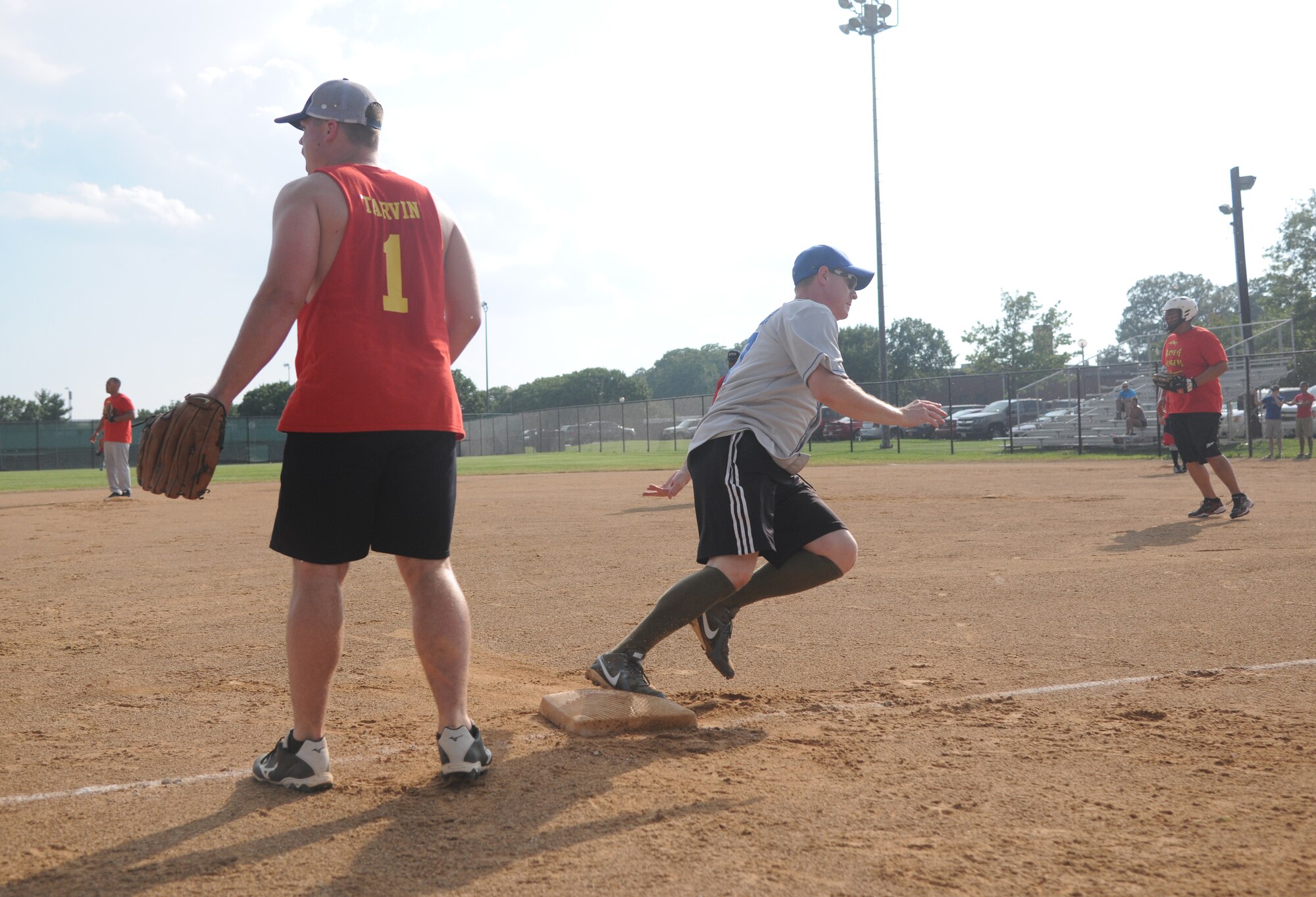 Capt. Stephen Squier, 1st Helicopter Squadron special missions pilot, rounds third base during the Joint Base Andrews’ championship softball game, July 21, 2015, at the West Fitness Center softball fields. The 174th Air Defense Artillery Brigade softball team won the first game against the 1st Helicopter Squadron softball team 16-15. (U.S. Air Force photo/ Airman 1st Class J.D. Maidens)