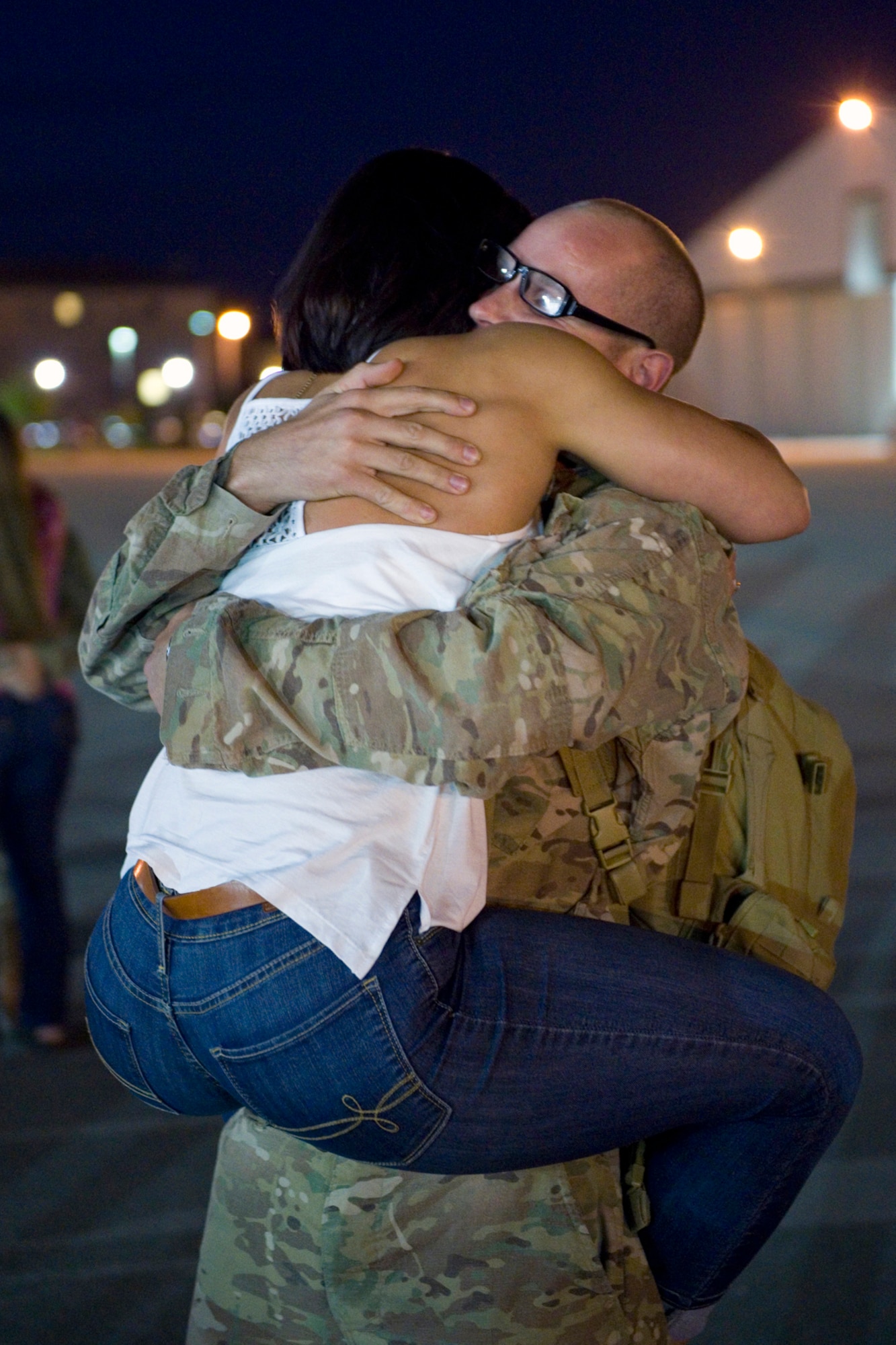 Master Sgt. Robert T. Dill, III, 434th Civil Engineer Squadron power production journeyman, receives a warm welcome from his wife Jessica upon his return to Grissom Air Reserve Base, Ind., July 22, 2015. Dill was among a group of 19 civil engineers who completed a 180-day deployment to Southwest Asia. (U.S. Air Force photo/Tech. Sgt. Benjamin Mota)