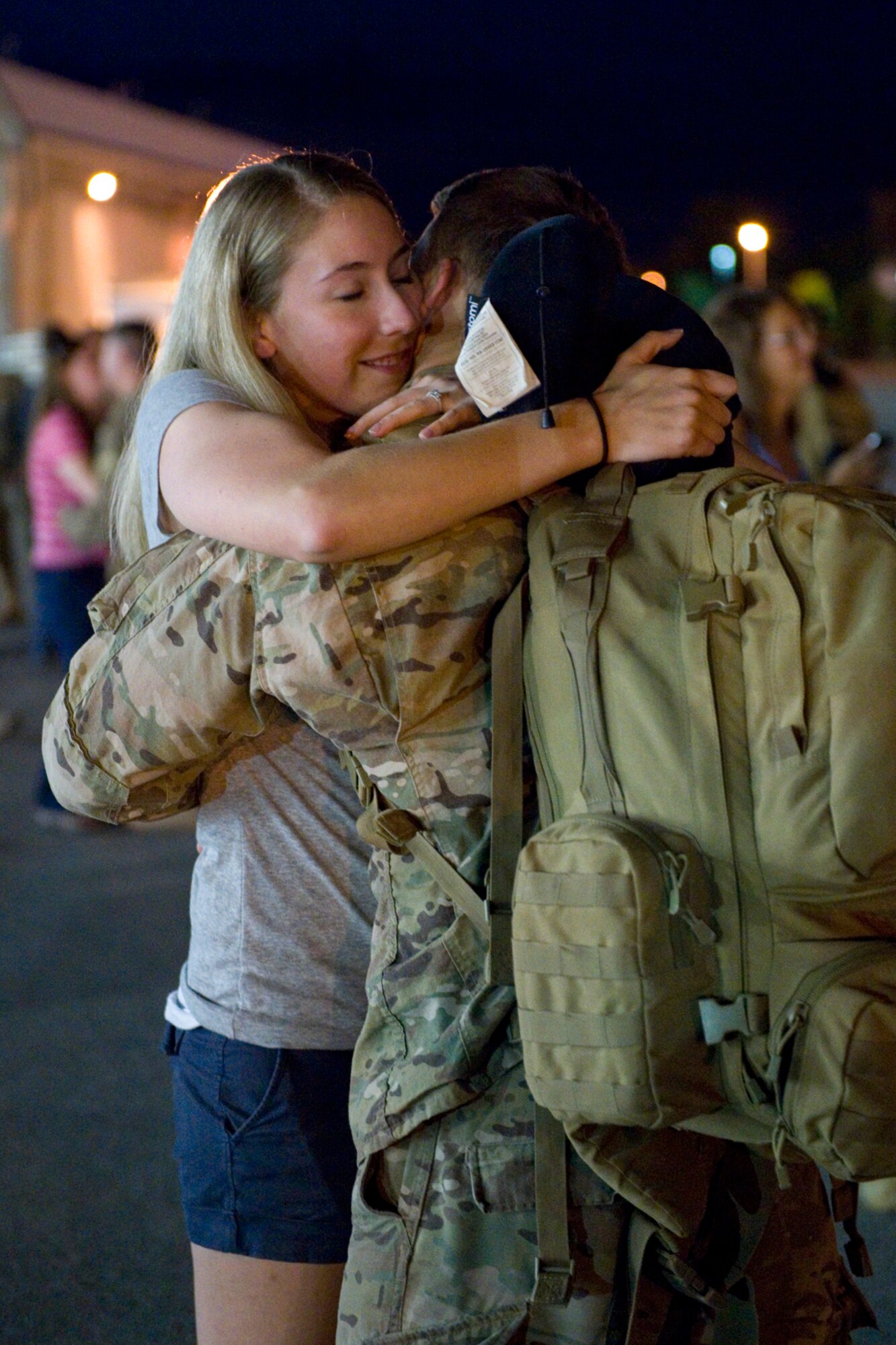 Staff Sgt. Gabriel Wood, 434th CES electrical systems specialist, embraces his finance, Kristen Nottelmann, after returning to Grissom Air Reserve Base, Ind., July 22, 2015. Wood and 18 others from 434th CES members returned from a 180-day deployment to Southwest Asia. (U.S. Air Force photo/Tech. Sgt. Benjamin Mota)