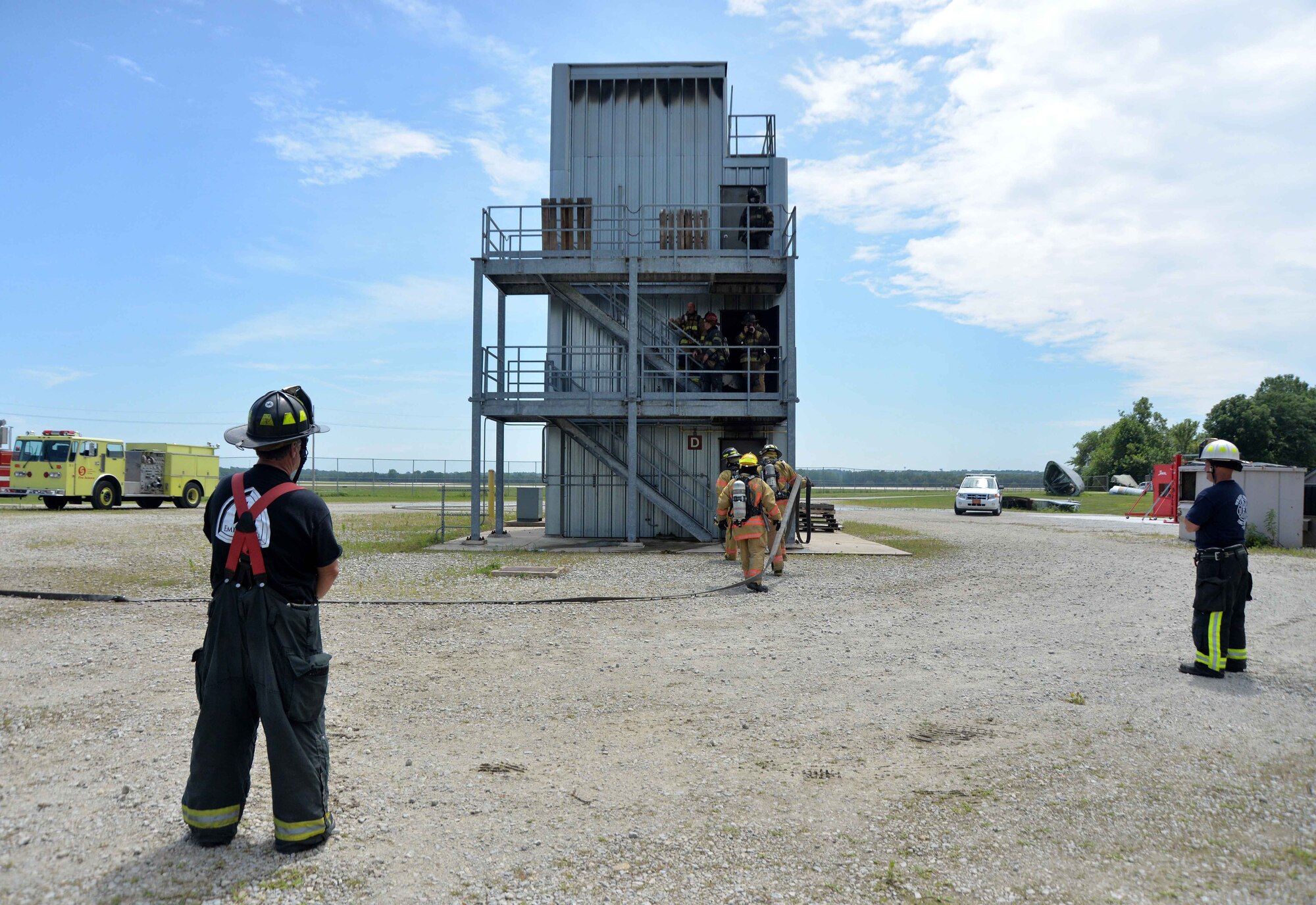 Students from Sinclair Community College's Fire Academy participate in live fire training exercises at the Fire Training exercises at the Fire Training Center at Wright-Patterson Air Force Base July 16. The students are monitored by instructors from the college and fire fighters from Wright-Patterson AFB and the local community.