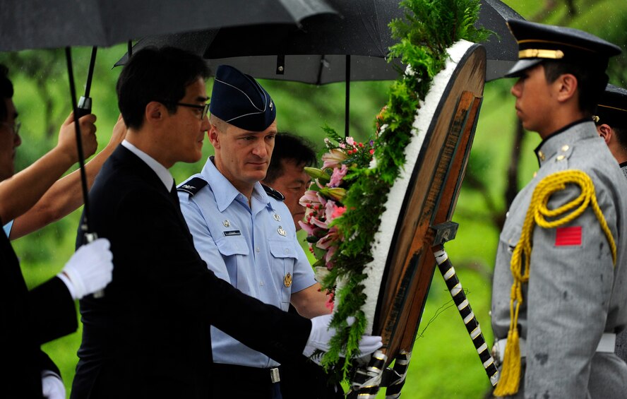 Mr. Yi Byong-goo, Regional director of the Ministry of Patriots and Veterans Affairs, Gwangju, Republic of Korea, lays a wreath with Col Seth Frank, 8th Fighter Wing Mission Support Group Commander, Kunsan Air Base, ROK, at the start of a Korean Armistice Agreement anniversary ceremony at Imsil National Cemetery, ROK, July 24, 2015. The MPVA invited the 8th Fighter Wing to participate in the event as representatives of the U.S. military. (U.S. Air Force photo by Staff Sgt. Nick Wilson/Released)