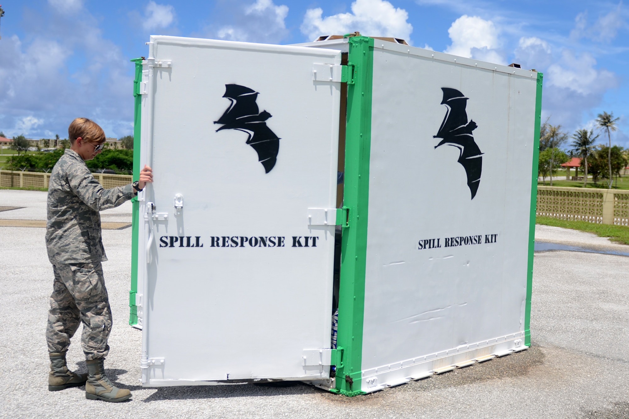 2nd Lt. Cari Gandy, 36th Civil Engineer Squadron environmental engineer, surveys the contents of an airfield spill response kit July 22, 2015, at Andersen Air Force Base, Guam. The kits were implemented as an effort to maintain fuel spills in a quick and convenient manner until dedicated response teams arrive. (U.S. Air Force photo by Airman 1st Class Alexa Ann Henderson/Released)