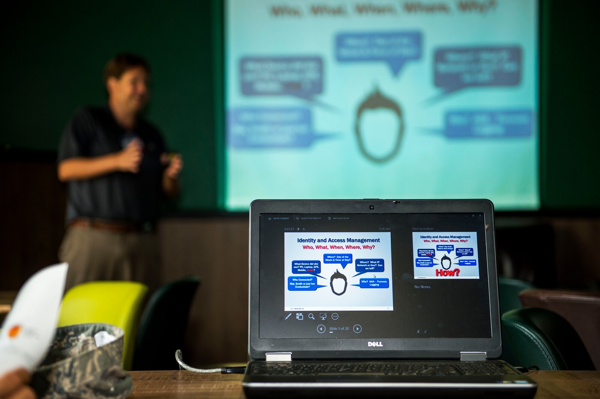 A technology industry representative gives a presentation to members of the Spangdahlem community during the Tech Expo at Club Eifel on Spangdahlem Air Base, Germany, July 22, 2015. Exhibitors briefed attendees on new technology and services their companies can provide in cyberspace capabilities and defense. (U.S. Air Force photo by Airman 1st Class Timothy Kim/Released)