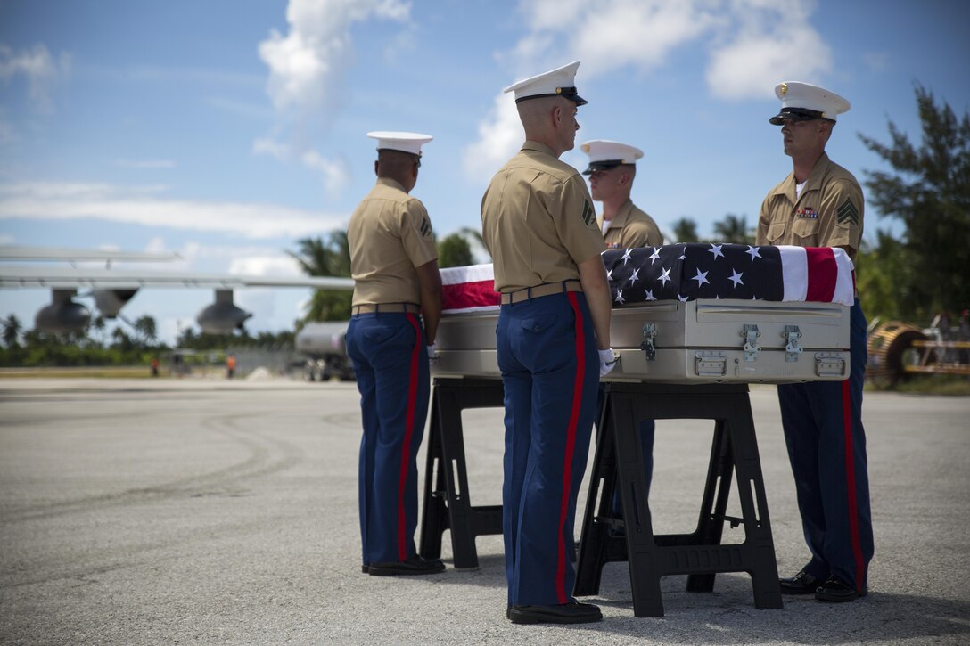 3rd Marine Regiment pallbearers prepare to escort a casket of remains onto a C-130J Hercules aircraft, July 25, 2015, during a repatriation ceremony in Tarawa, Kiribati. The ceremony honored the remains of approximately 36 Marines who fought and died during the Battle of Tarawa in World War II, and are being transported back to the United States for proper identification and final burial.