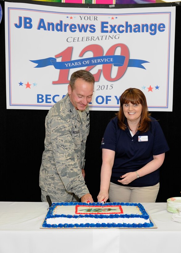 Col. Brad Hoagland, left, 11th Wing/Joint Base Andrews commander, and Joanne Cahalan, JBA Exchange store manager, cut a cake in celebration of the Army and Air Force Exchange Service's 120th anniversary July 25, 2015, here. Since 1895, the AAFES has provided Soldiers and Airmen with services and merchandise to need to make their lives more comfortable. (U.S. Air Force photo by Senior Airman Preston Webb/RELEASED)